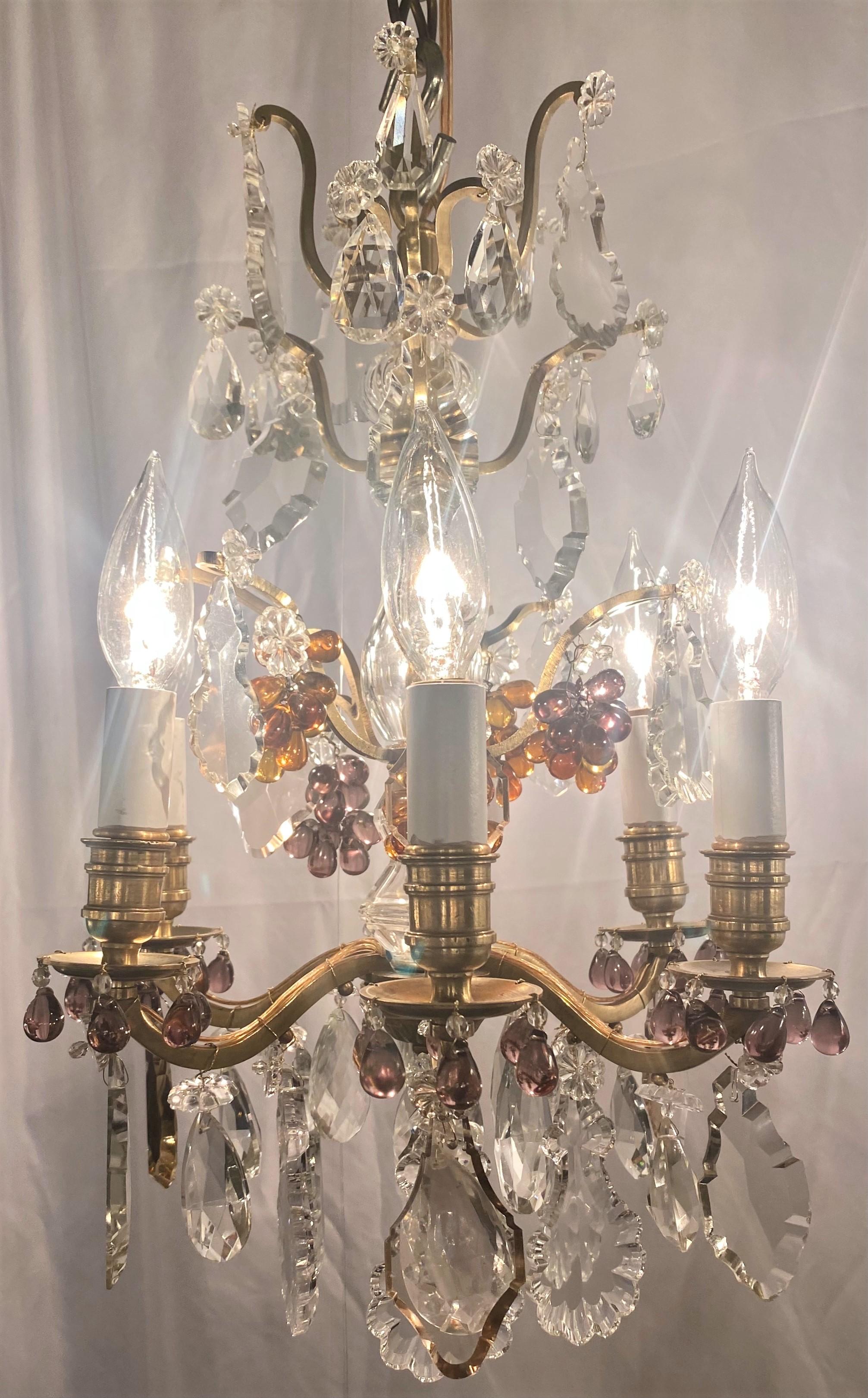 Small pair of antique 19th century French gold bronze, cut clear crystal and colored crystal chandeliers.
 