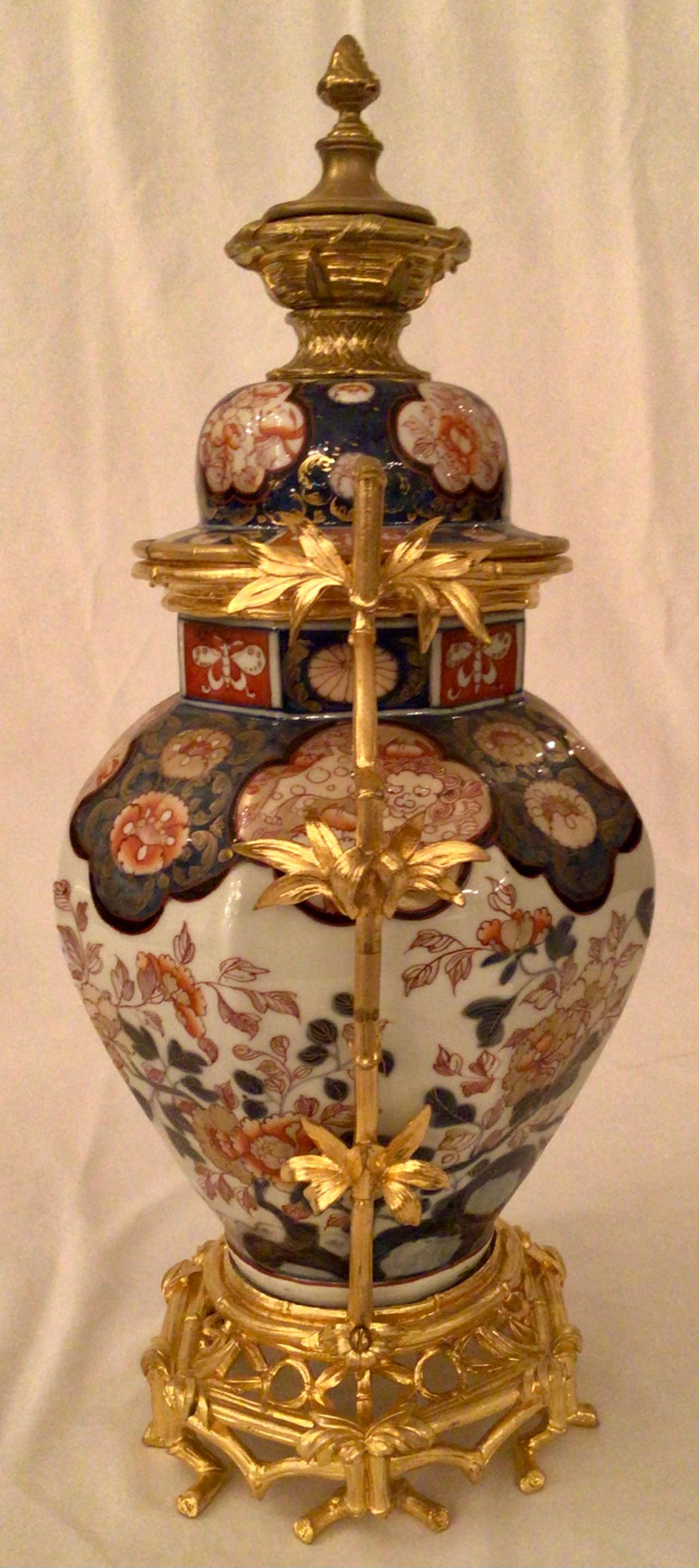 Japonisme Pair of 19th Century Imari Porcelain and Ormolu Mounted Urns, circa 1840-1860