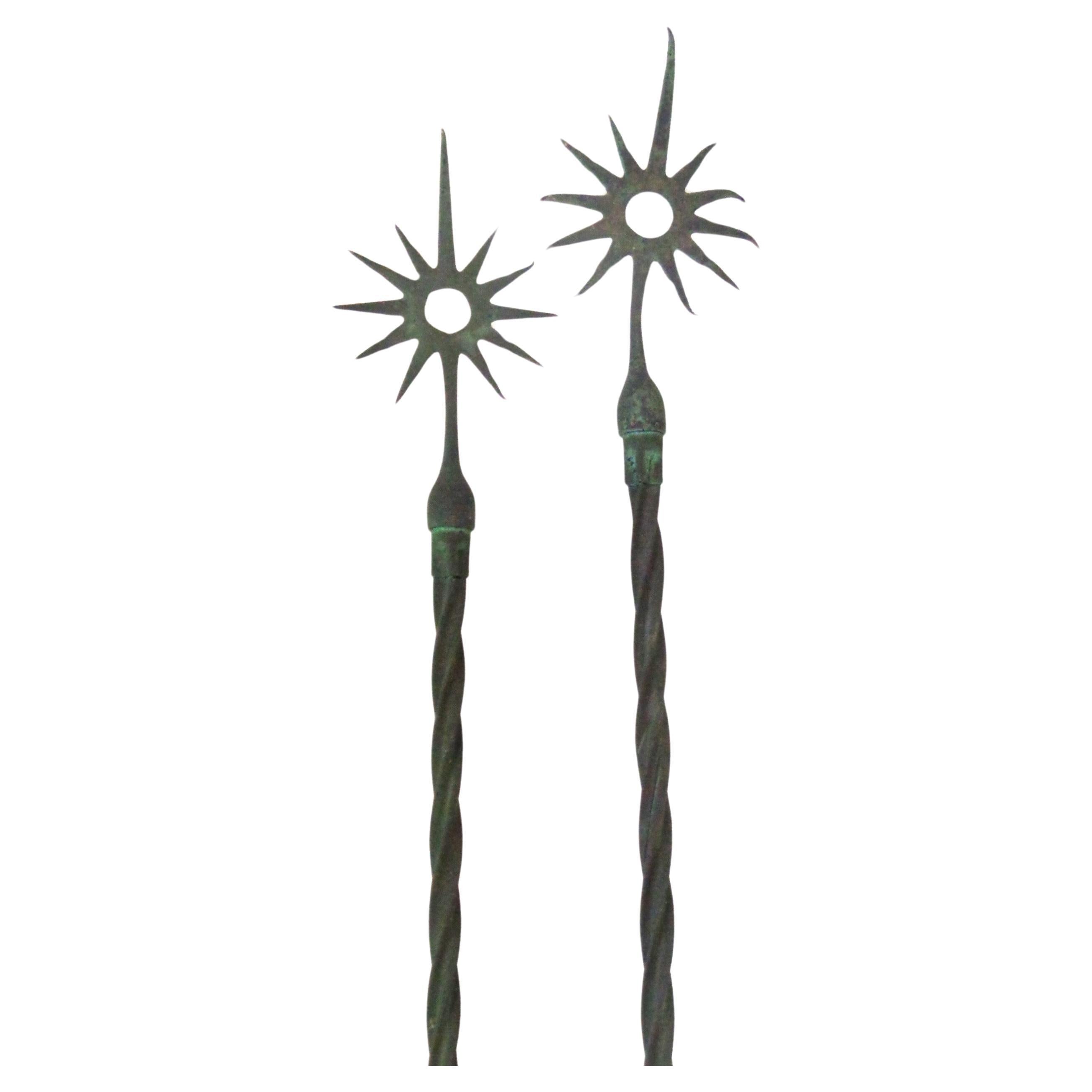 Pair of antique American lightning rods with twisted copper skinned wrought iron shafts / iron tripod stands / eleven point sunburst copper tops. Both lighting rods in original as found antique condition w/ beautiful naturally aged verdigris patina.