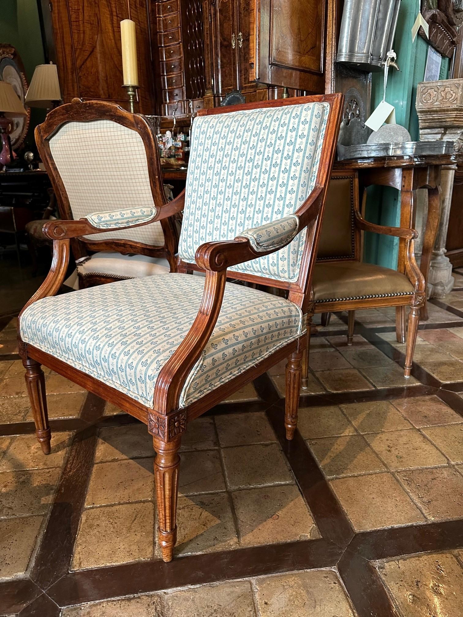 Pair Antique Armchairs Louis XVI Fauteuils in Walnut Dining Entrance Side chairs. Two chairs out of a (Set of Six total) important 18th century Louis XVI of the Period French Chairs. Carved beautifully in Walnut and a fantastic patina. Upholstered