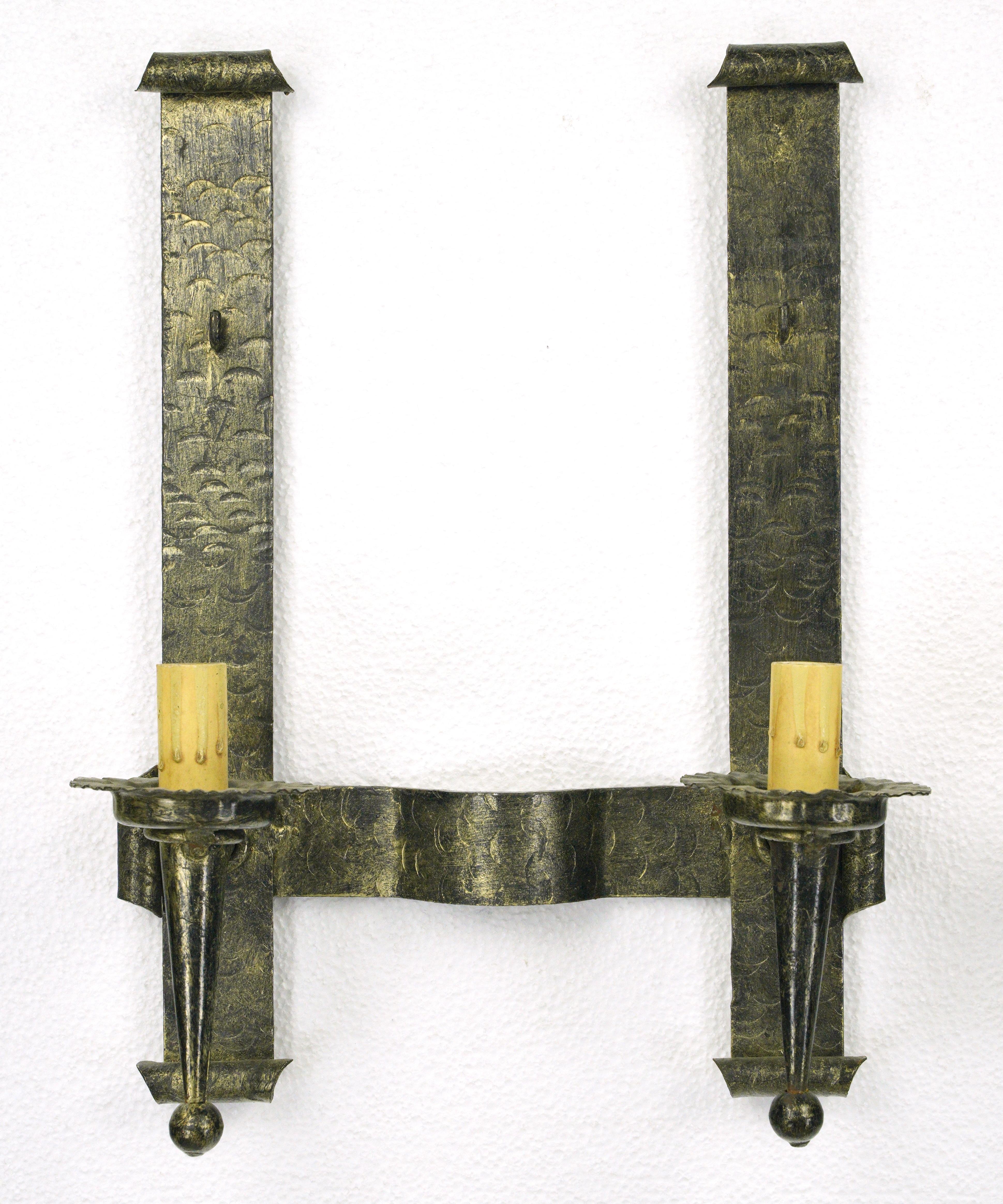 Antique Arts & Crafts blackened steel two arm wall sconces. Good condition with appropriate wear from age. These lights are wired and ready to ship. Cleaned and restored. Priced as a pair. Please note, this item is located in our Scranton, PA