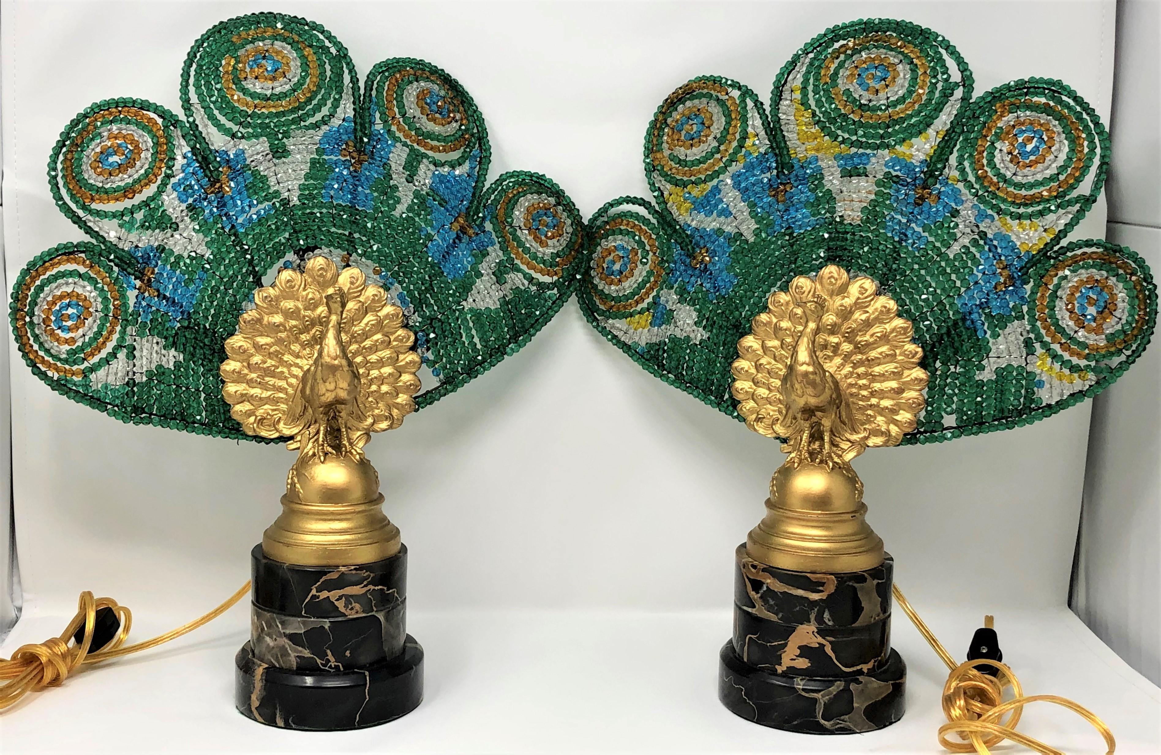 Pair of antique Austrian peacock lamps, bronze and marble with art glass plumes, circa 1920-1930.
Measures: Base is 4 1/2
