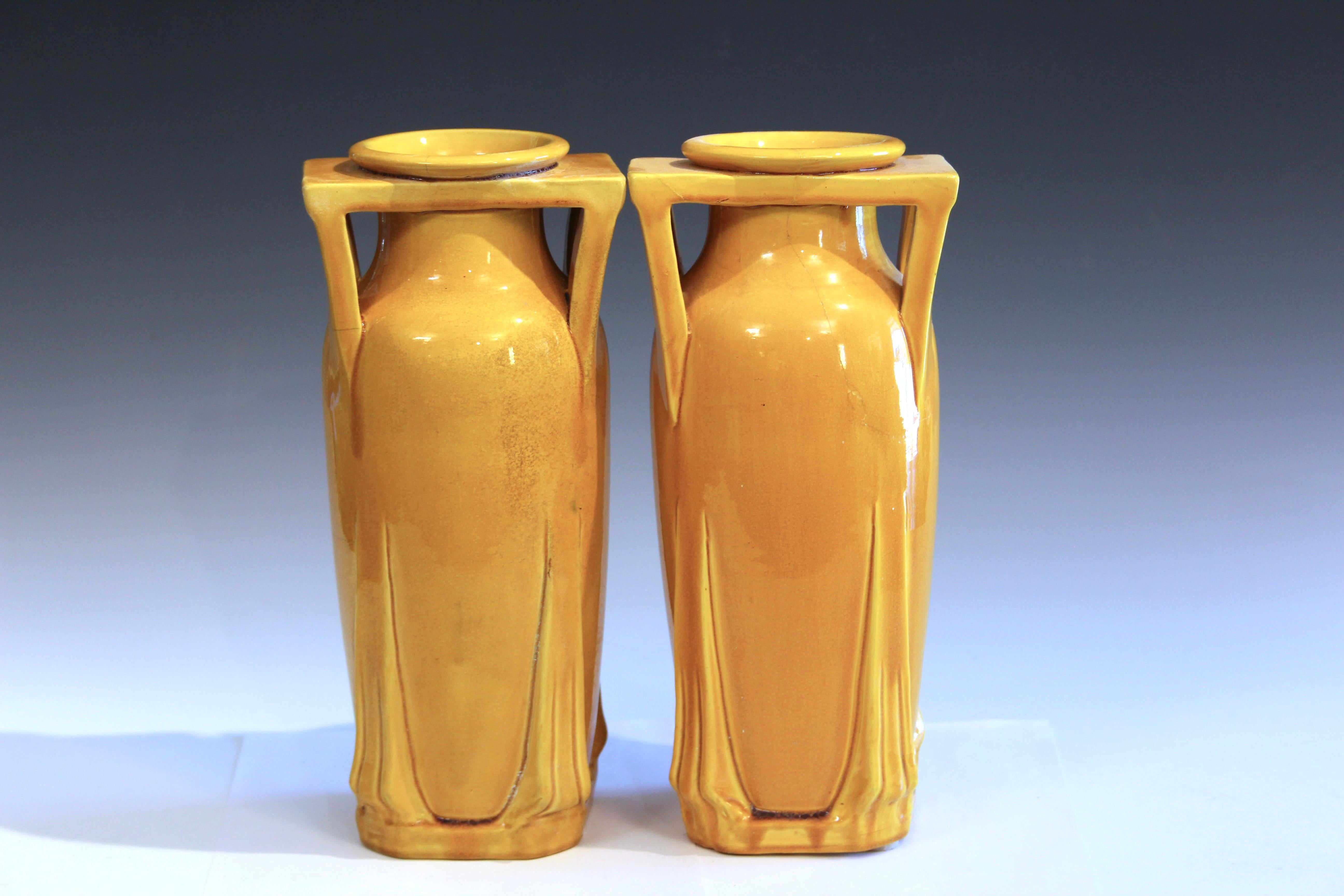 Pair antique Awaji pottery vases in buttress handled architectural form with yellow monochrome glaze. 12