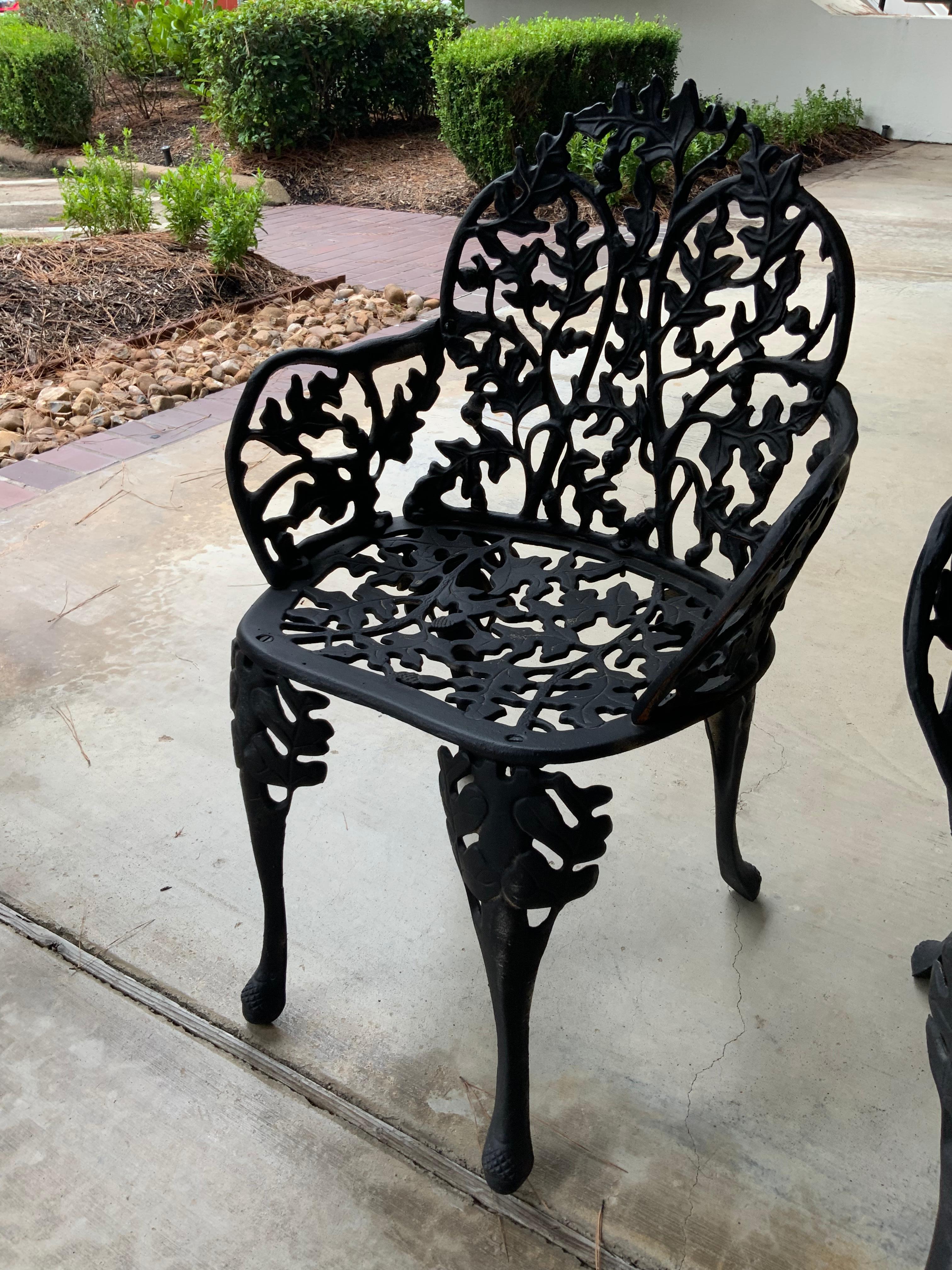 Painted Pair Antique Black Iron Garden Chairs with Faux Bois Design Acorn and Foliate For Sale