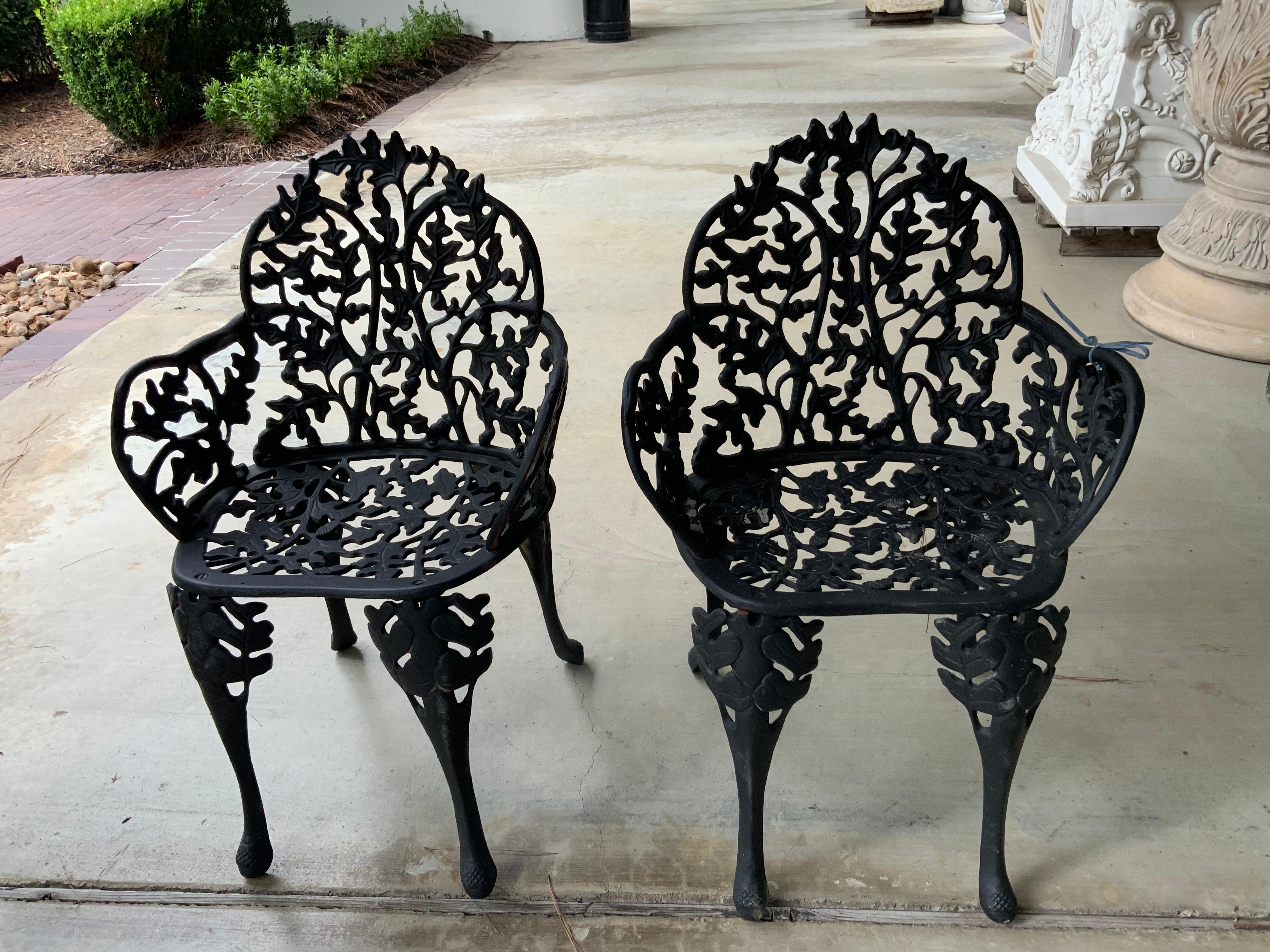 Pair Antique Black Iron Garden Chairs with Faux Bois Design Acorn and Foliate In Good Condition For Sale In Houston, TX