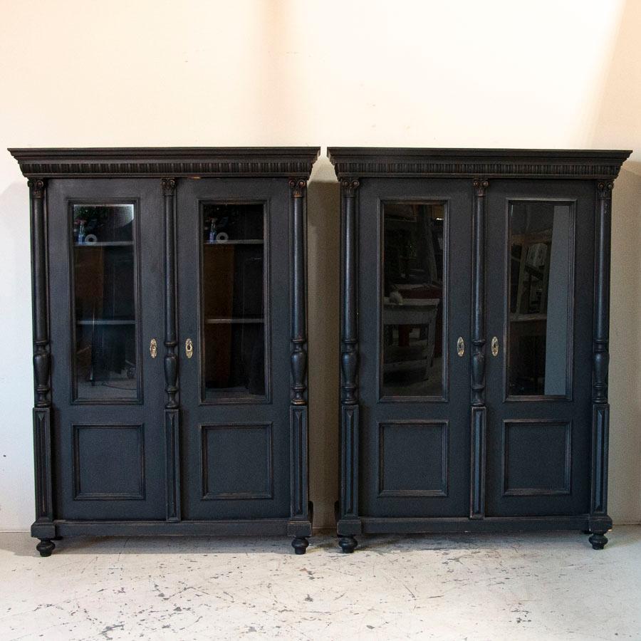 It is difficult to find pairs of display cabinets, so this matched set of 2 bookcases makes them extra special. One notices the symmetry and balance of the Swedish styling in the glass panels above smaller panels in the doors. In photo #5, you will