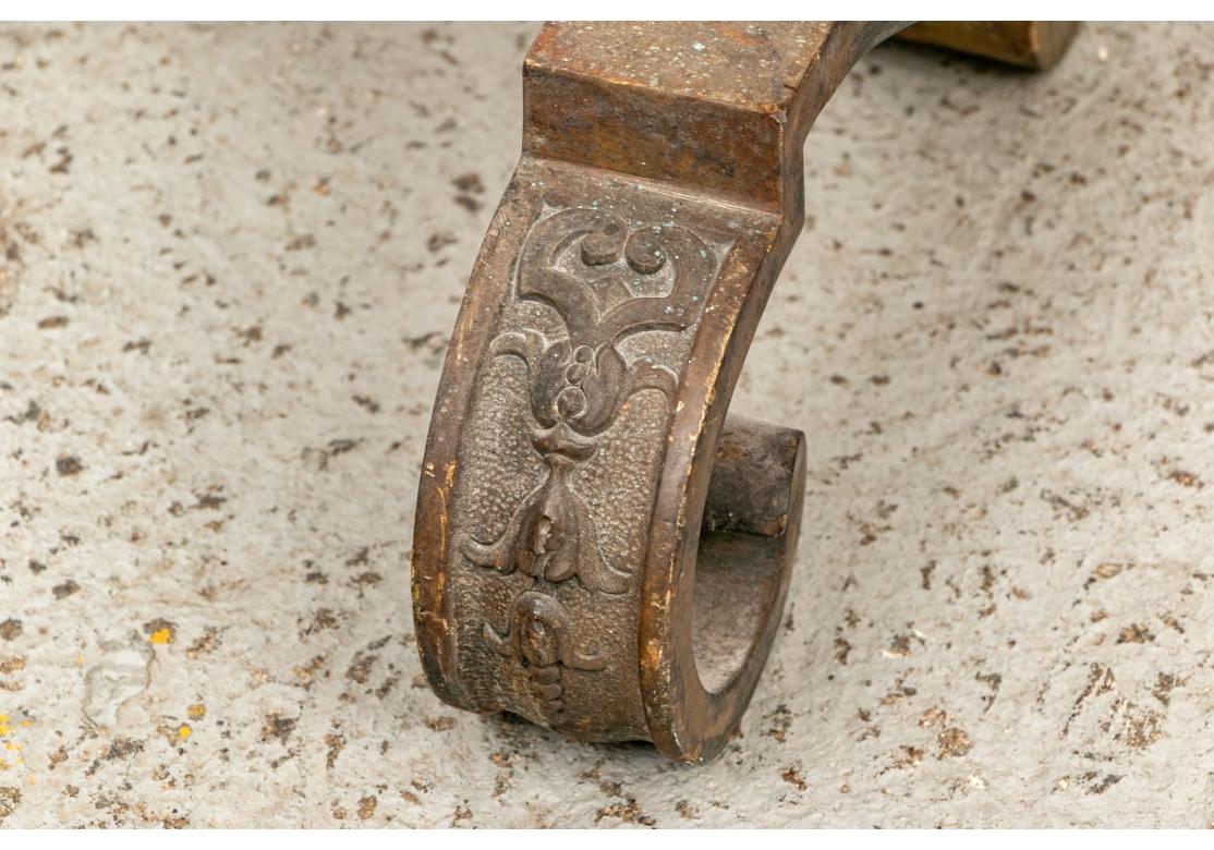 Tall brass baluster and lobed form andirons with ball finials. Scrolled feet with relief foliate decoration, and long iron bars in the back. Wonderful antique patina. 

Dimensions: H. 27 1/2