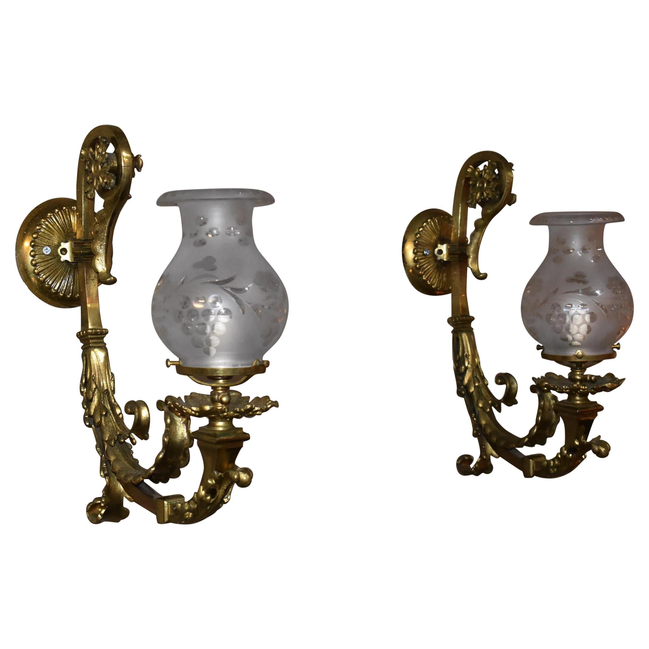 Pair of Antique Brass Ornate Wall Sconces Astral Cut and Polished Glass Shades	