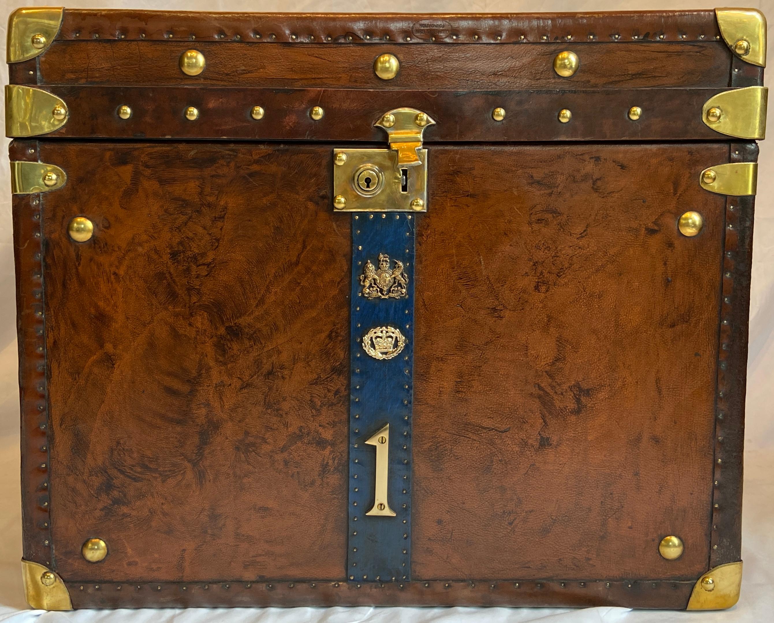 Pair antique British military leather luggage chests with insignia of warrant officer or regimental sergeant major, circa 1920-1930.