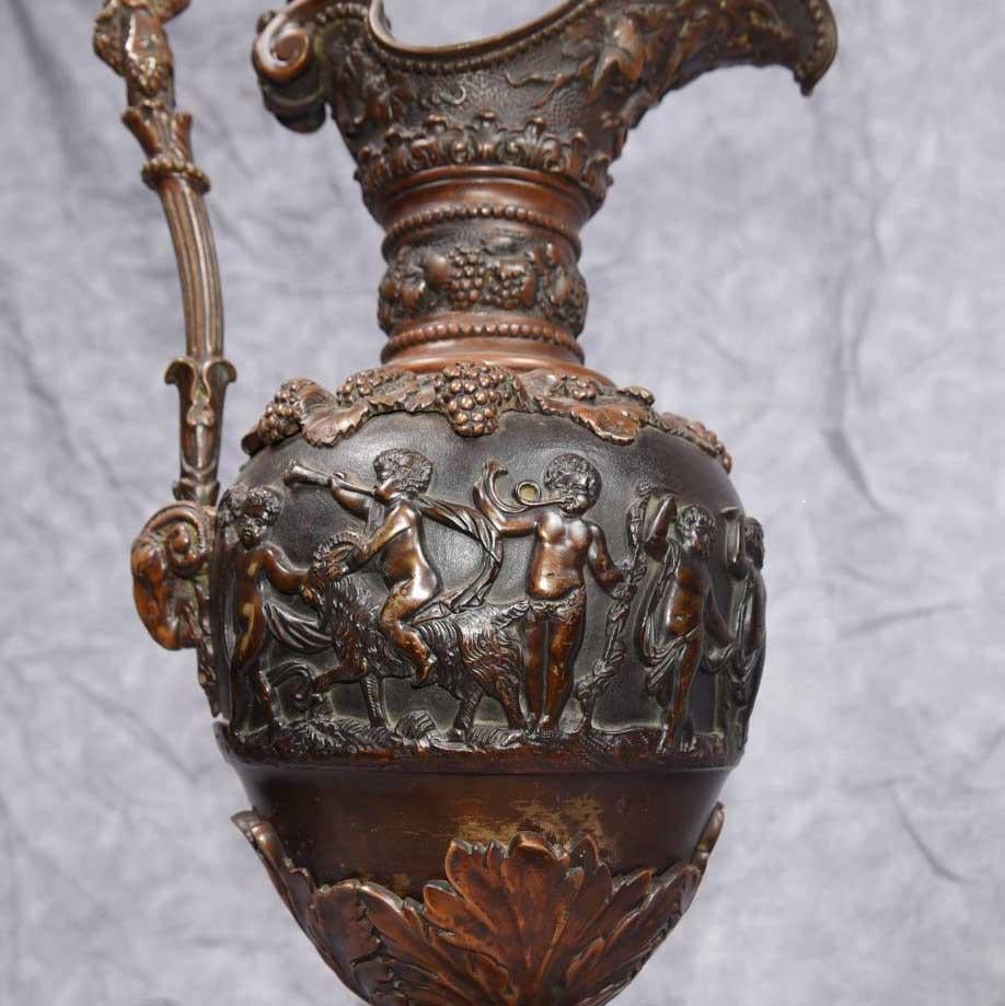 - Stunning pair of French antique bronze jugs in the form of amphora urns
- Lovely cherub relief frieze running around the circumference to this collectable pair
- Patina to the bronze is superb
- We date these to circa 1890
- Purchased from a