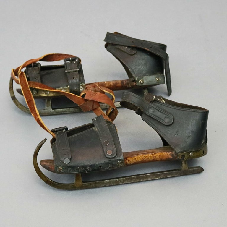 Pair of Antique Buckled Leather and Wood Ice Skates, 19th Century at