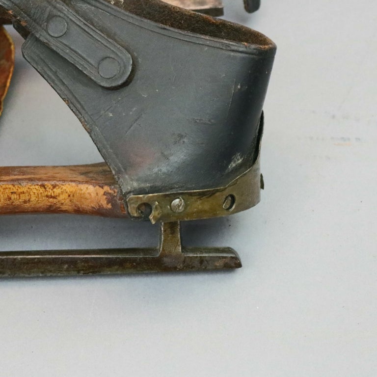 Pair of Antique Buckled Leather and Wood Ice Skates, 19th Century at