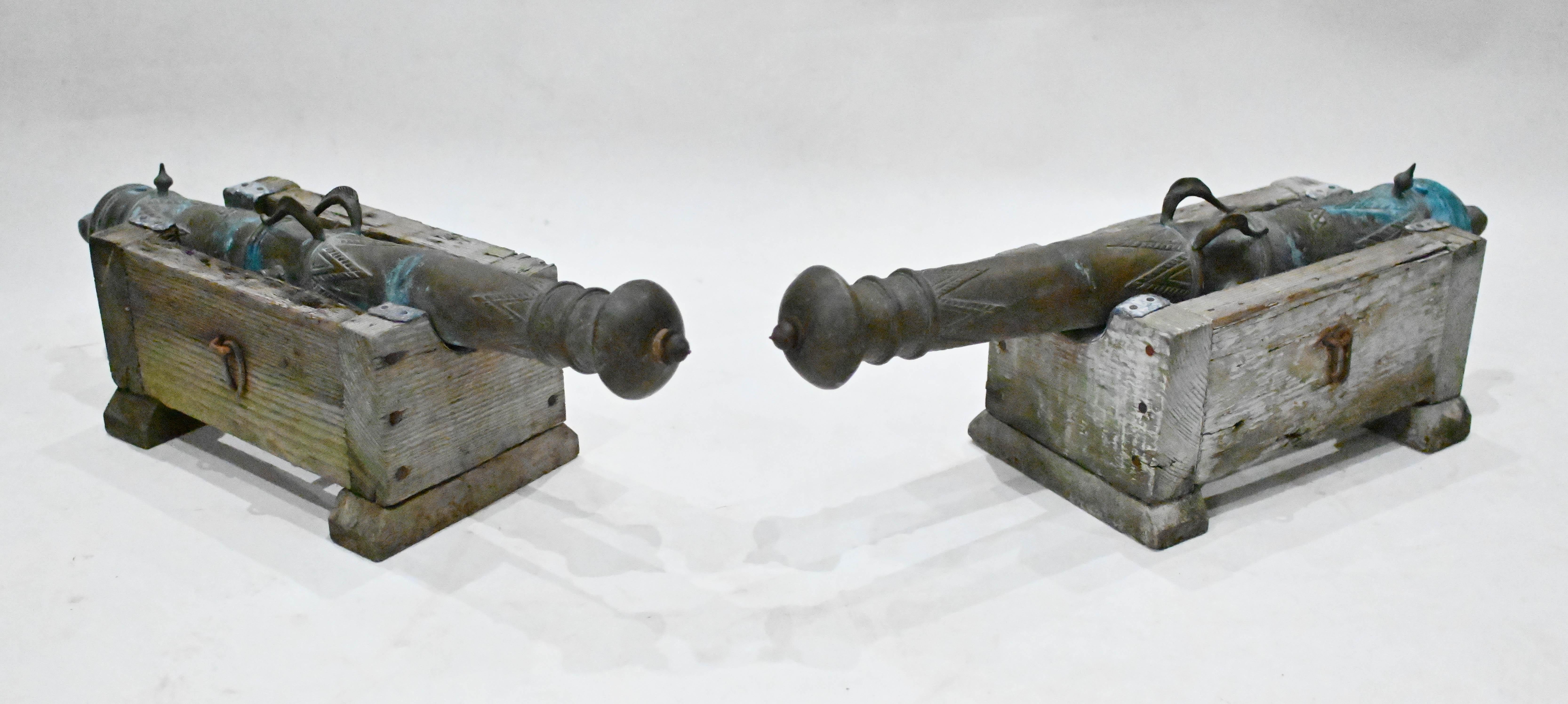 Gorgeous pair of antique cannons with bronze barrels
Great interiors pair would look great either side of a door We date this pair to circva 1840
The cannons sit on the wooden bases with antiqued finish to wood Offered in great condition ready for