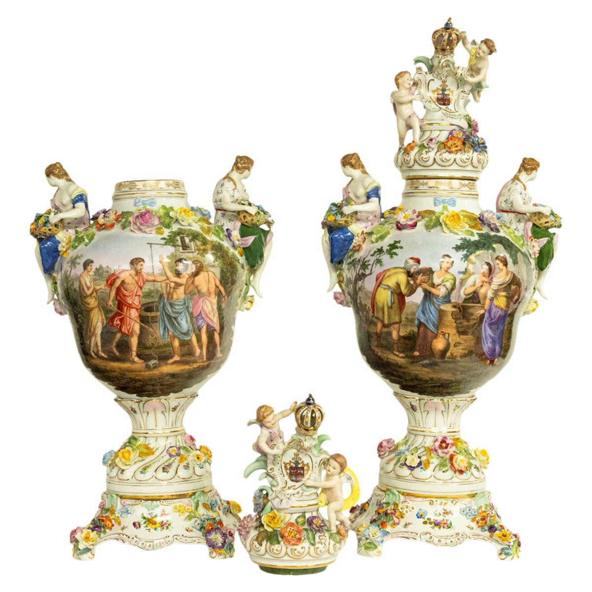 A very fine & monumental pair of late 19th century Porcelain lidded urns on pedestals by Carl Thieme (Potschappel) circa 1880.
The urns are in three three sections & are very lavishly decorated, each lid having a gilded finial modeled as a coronet,