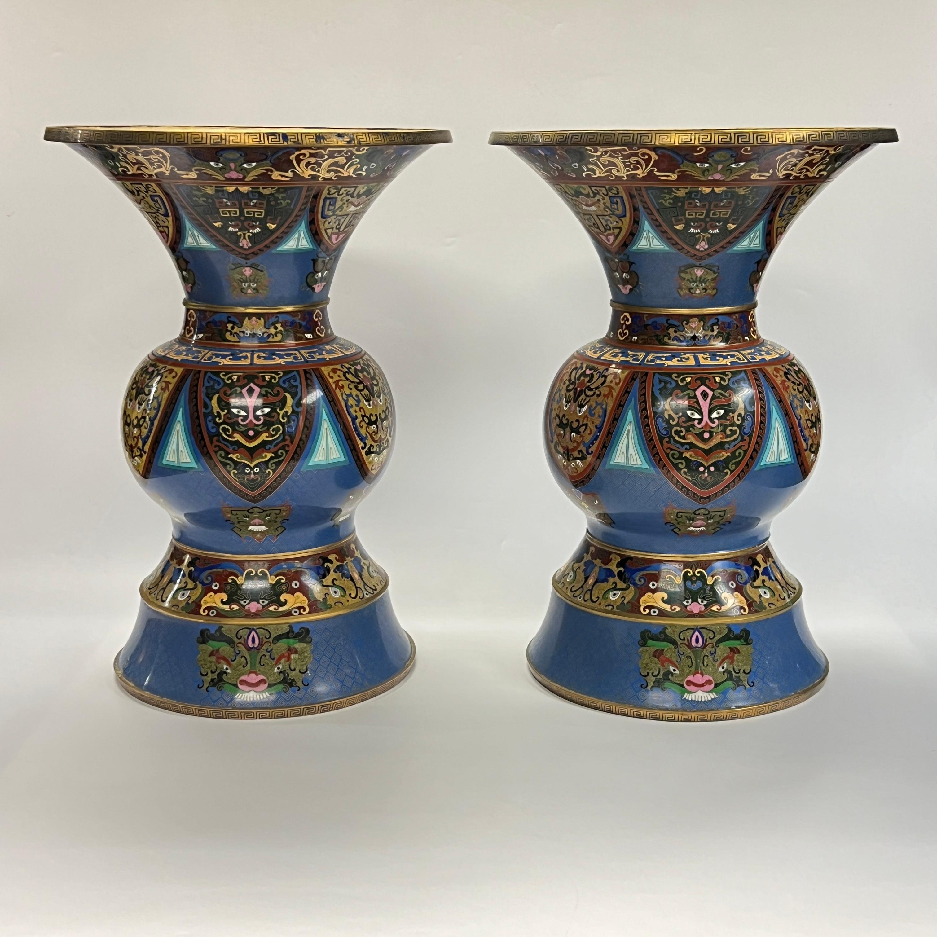 Pair of very large and finest quality , 24 inch tall, antique Chinese cloisonne vases with wide flared rims with fine cloisonne enamel designs including foo lions and exotic masks.  