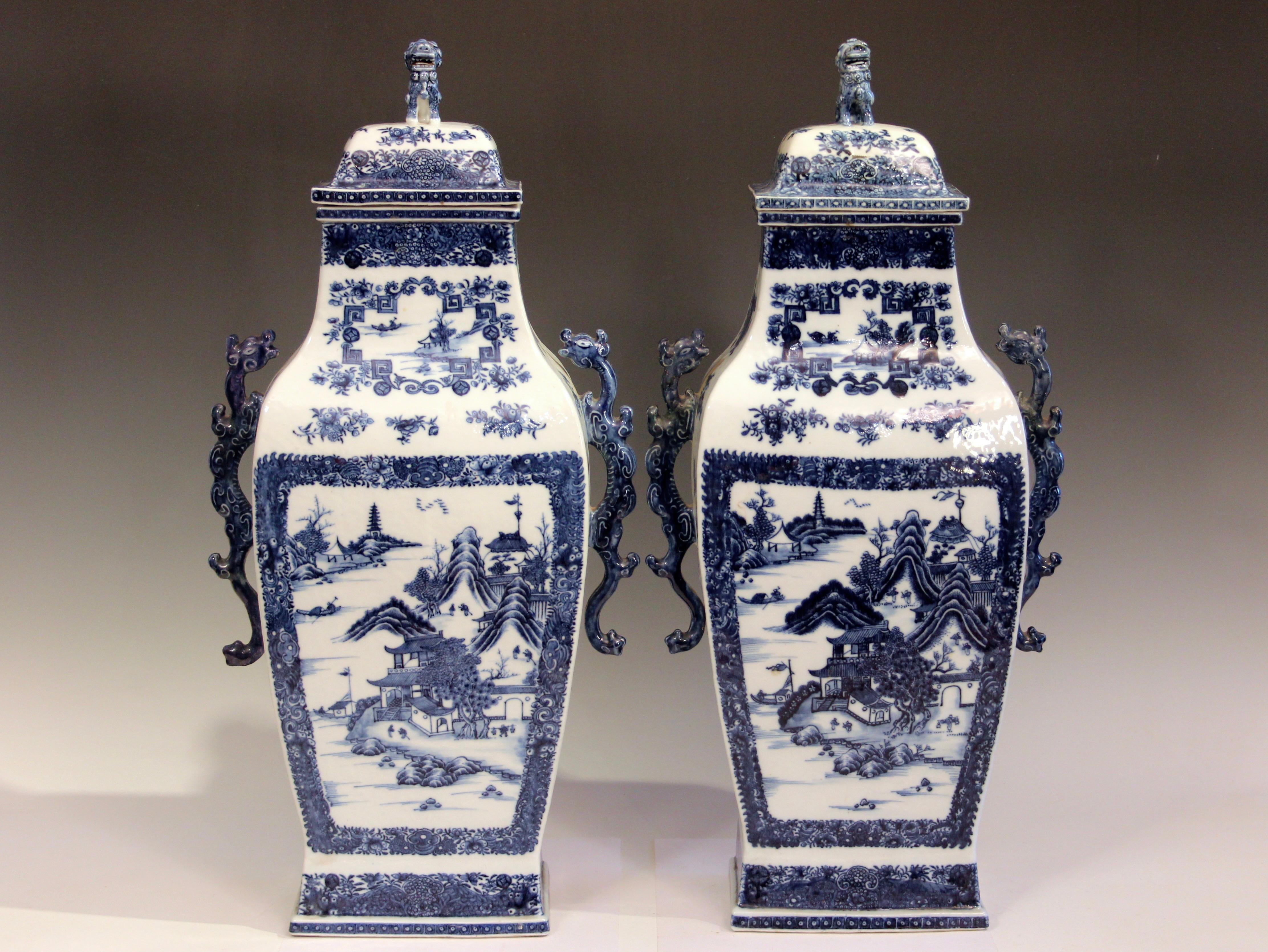 Pair antique Chinese export porcelain rectangular form urns with covers, in Nanking pattern, circa 1790's. Good color and crisp detail. Fanciful dragon form handles. These make an imposing garniture. Three of the handles with repairs, crack to base