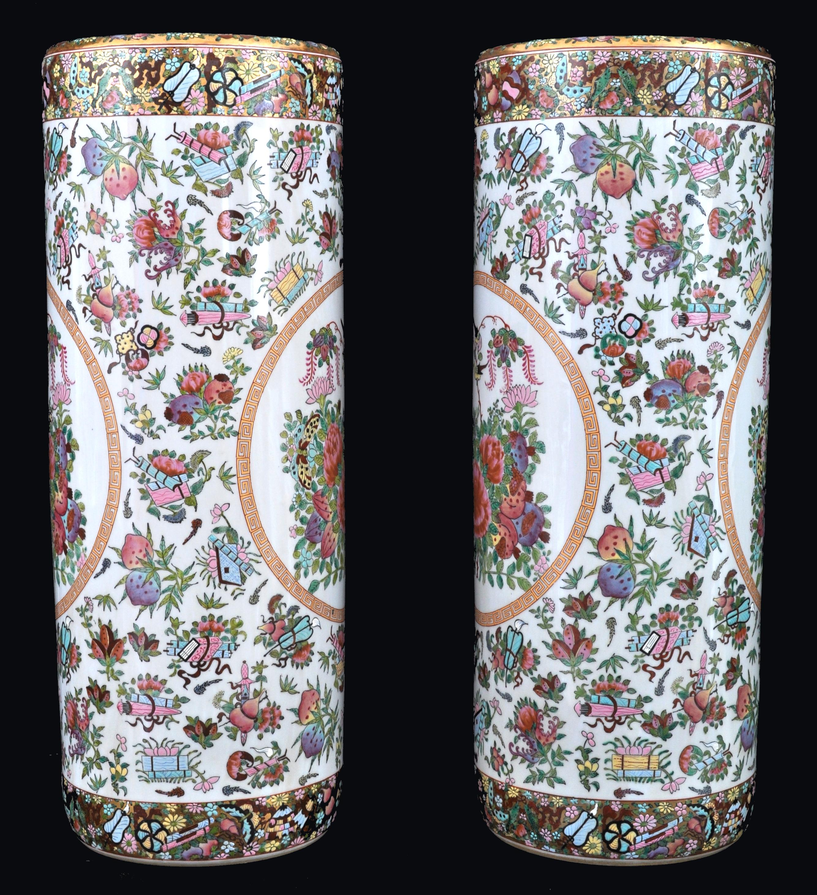 Pair of antique Chinese Famille Rose porcelain umbrella stands, Republic period, circa 1920. The stands having an all-over floral design with a central panel enclosing love birds. Each stand having a red six character mark to the base. Excellent