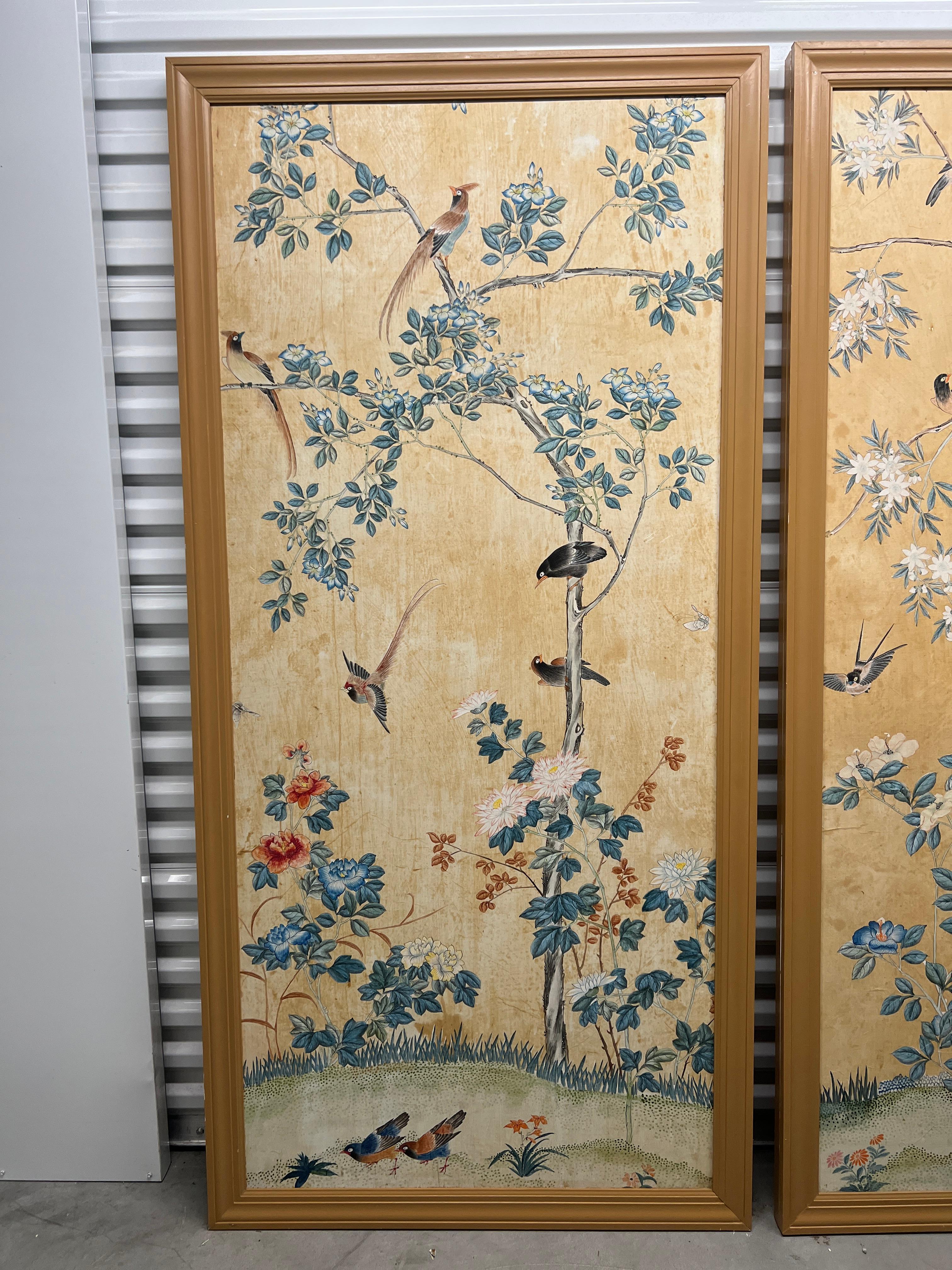 Late 19th to early 20th century. 

This exquisite pair of antique Chinese wallpaper panels, meticulously hand-painted, is a stunning example of traditional Chinese artistry. Each panel features a vibrant yellow background and depiction of foliate