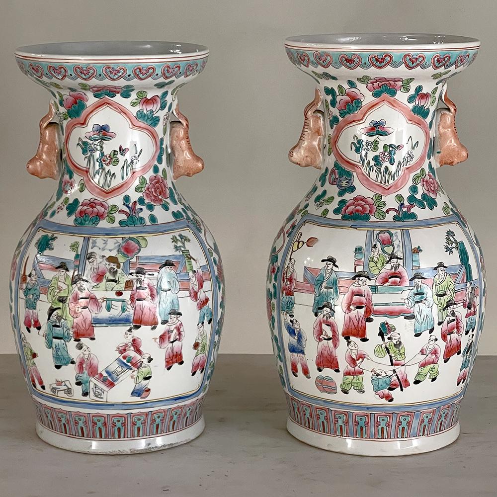 Pair Antique Chinese Hand-Painted Vases will make a colorful addition to your decor. Using several shades of green combined with blue and a brick red, a scene of entertaining at the court is depicted, with flowers, foliates and geometric designs
