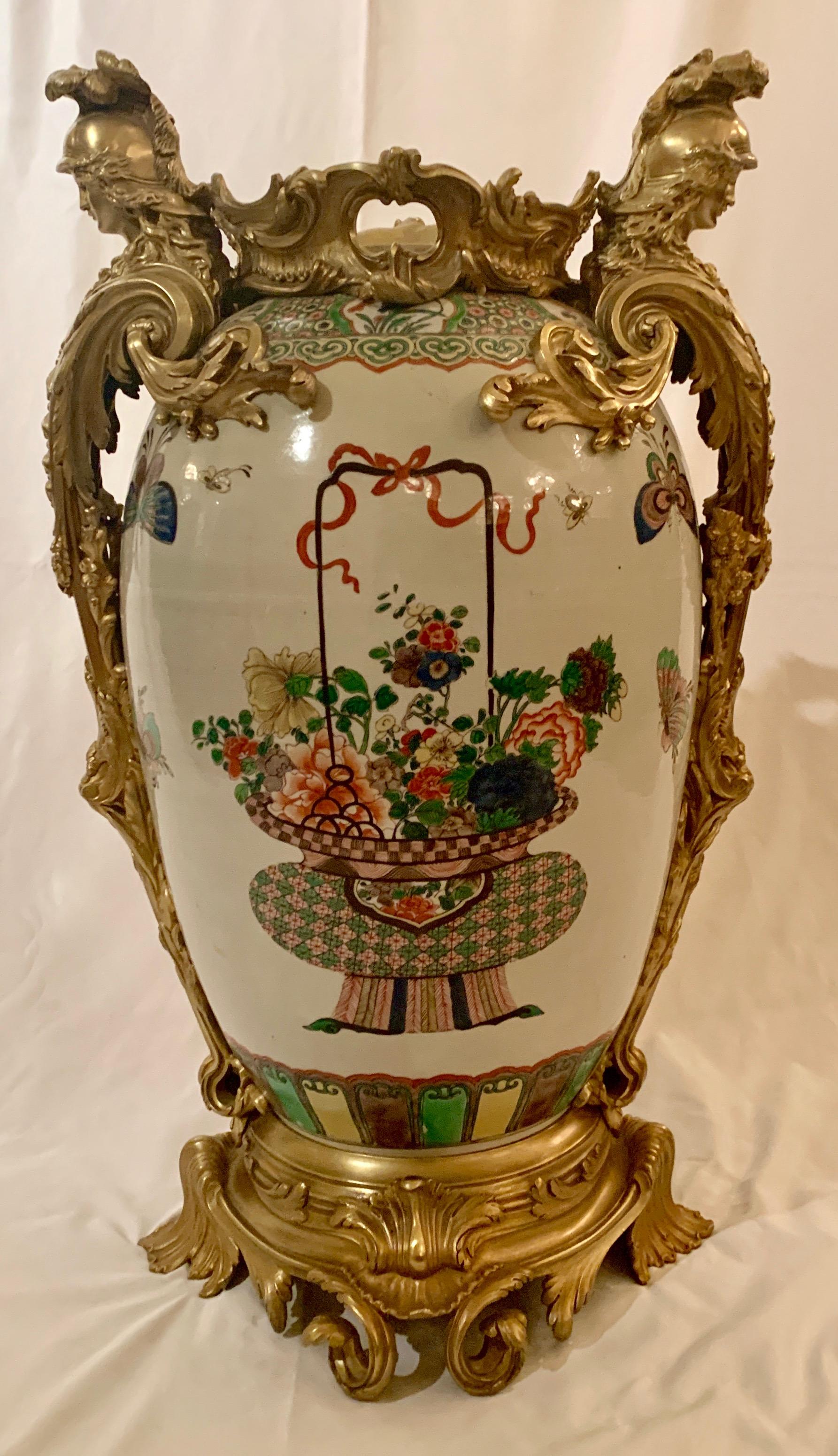 These are magnificent urns in the Chien Ling style. Very beautiful colors on the vases and of course, the ormolu trim is wonderful.
    