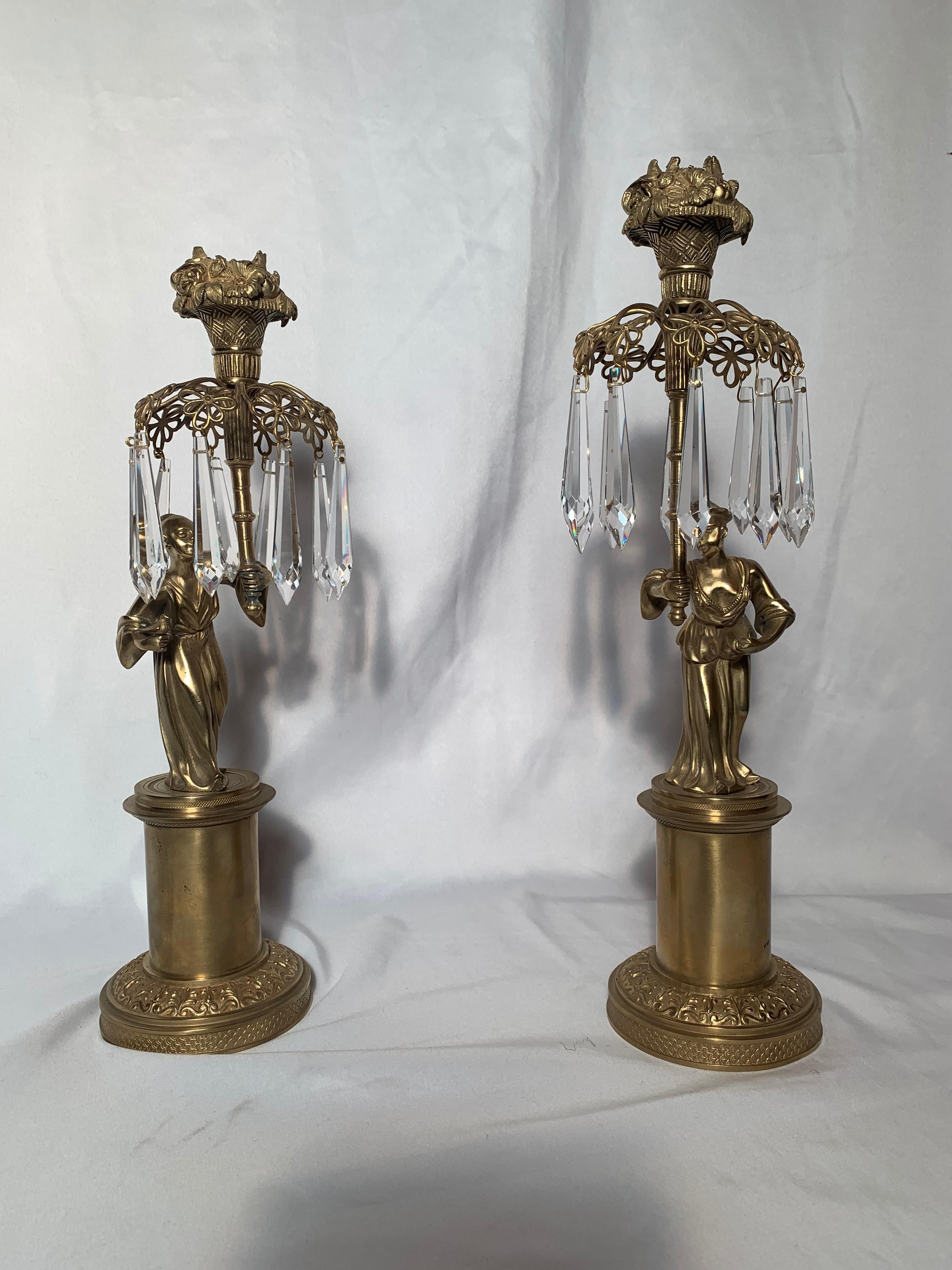 Pair of antique chinoiserie figurine candlesticks, circa 1865-1875.

       