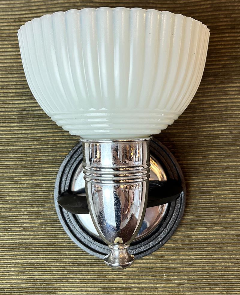 Beautiful pair of original 1930s Art Deco sconces attributed to Lightolier. Original chrome and metallic bronze finish paired with original pudding cup slip in shades. Rewired and CSA approved. Can be switched upon request

   -  $800 PAIR
    -