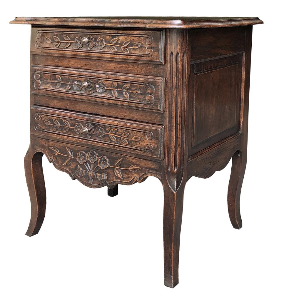 Pair of antique Country French Provincial commodes are a truly rare find! Excellent as nightstands, lingerie chests, or just to create a little symmetry in your room. Hand carved wild flowers and foliates in a charming rustic manner are carved