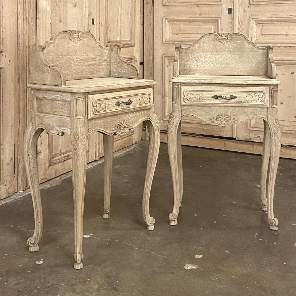 Pair of antique Country French stripped oak nightstands or end tables feature graceful lines, all handcrafted to perfection in the manner of the Louis XV style. Elegant cabriole legs all around support the scrolled and carved aprons underneath the