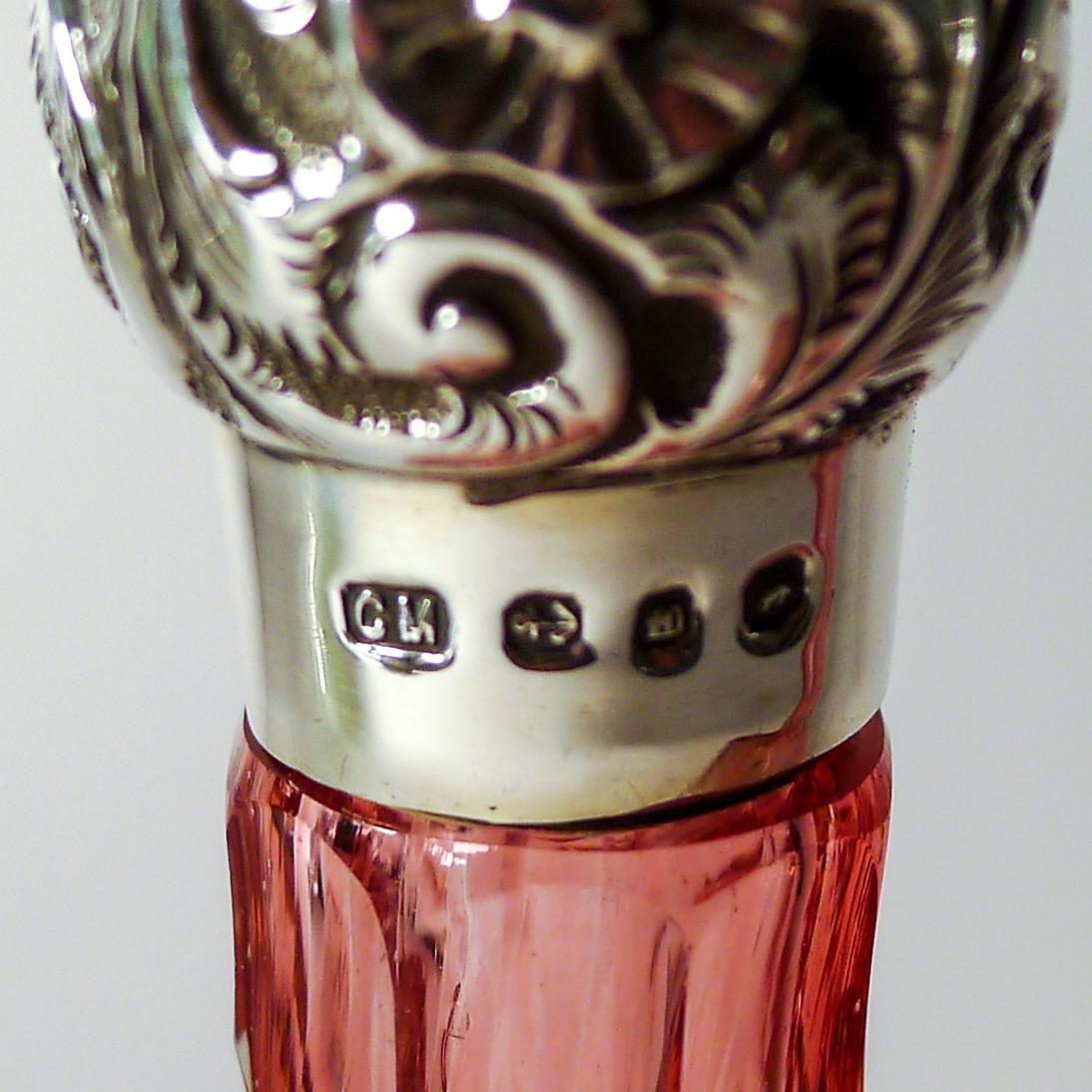 So rare to come across a pair of matching perfume bottles, this elegant pair are probably the most sought-after colour, Cranberry graduating down to a clearer glass at the base.

The screw-top lids are made from English sterling silver, hallmarked