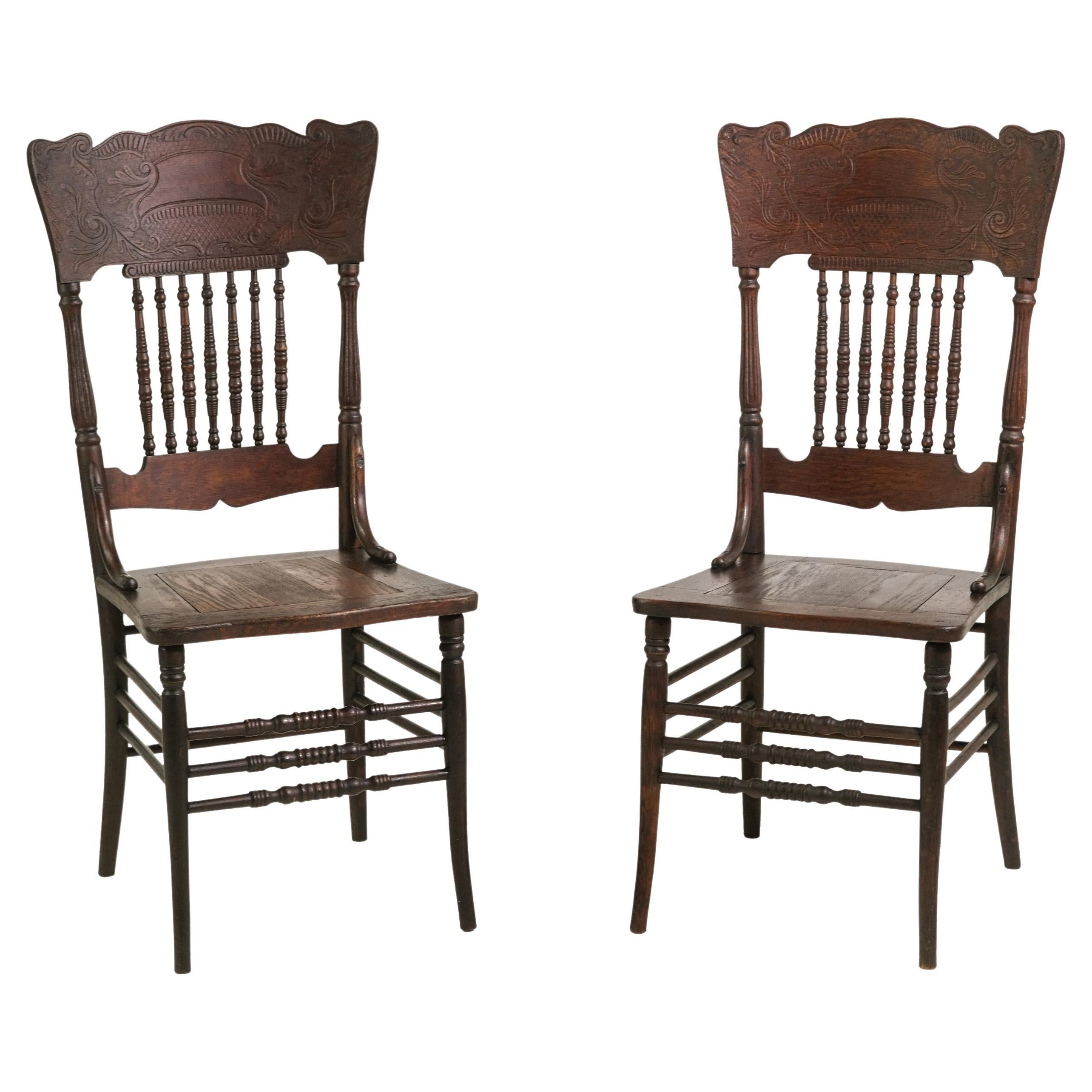 Pair Antique Dark Stain Oak Press Back Chairs Carved Details For Sale