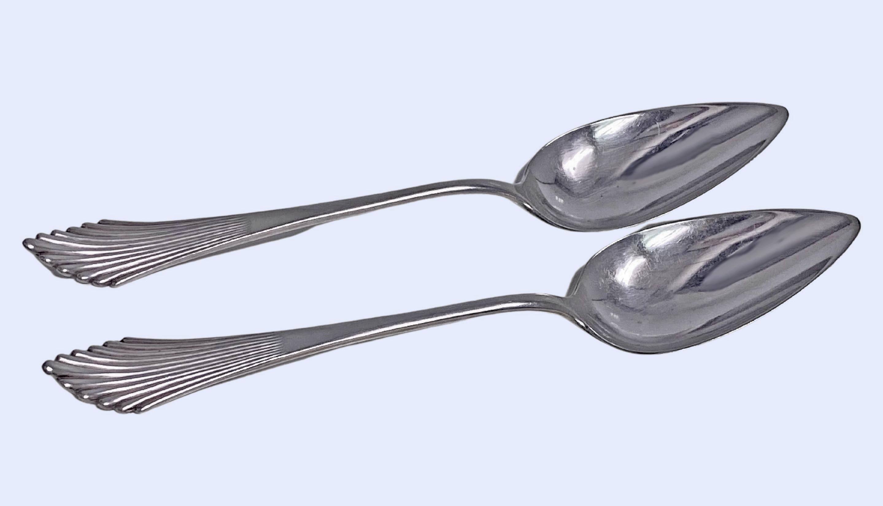 Pair Antique Dutch Silver Serving Spoons Gerritsen Utrecht 1916. Tapered ribbed fan design handles. Full hallmarks. Lengths: 10 3/8 inches. Weight: 8 oz. Reflections from photography only 