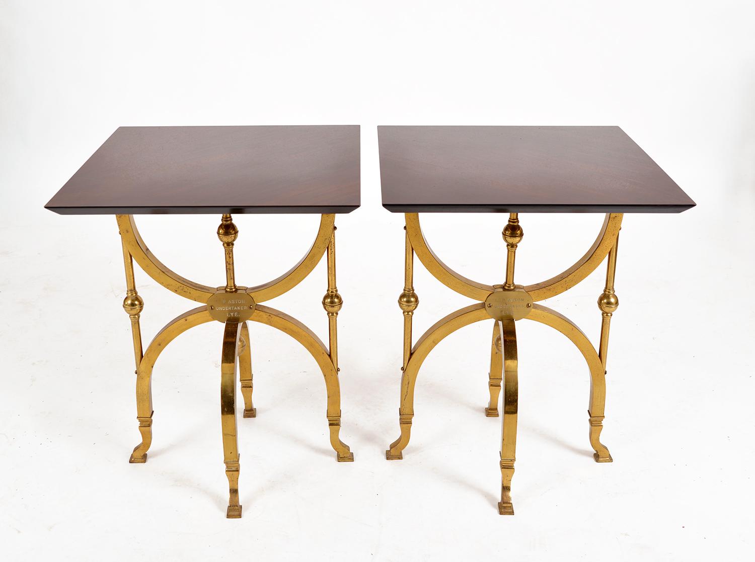 A really unusual pair of solid brass Edwardian coffin/casket stands, repurposed into a stunning and elegant pair of side tables. Each brass table base retains its original plaque, which was engraved with the undertaker – “L.P. Aston, Undertaker.