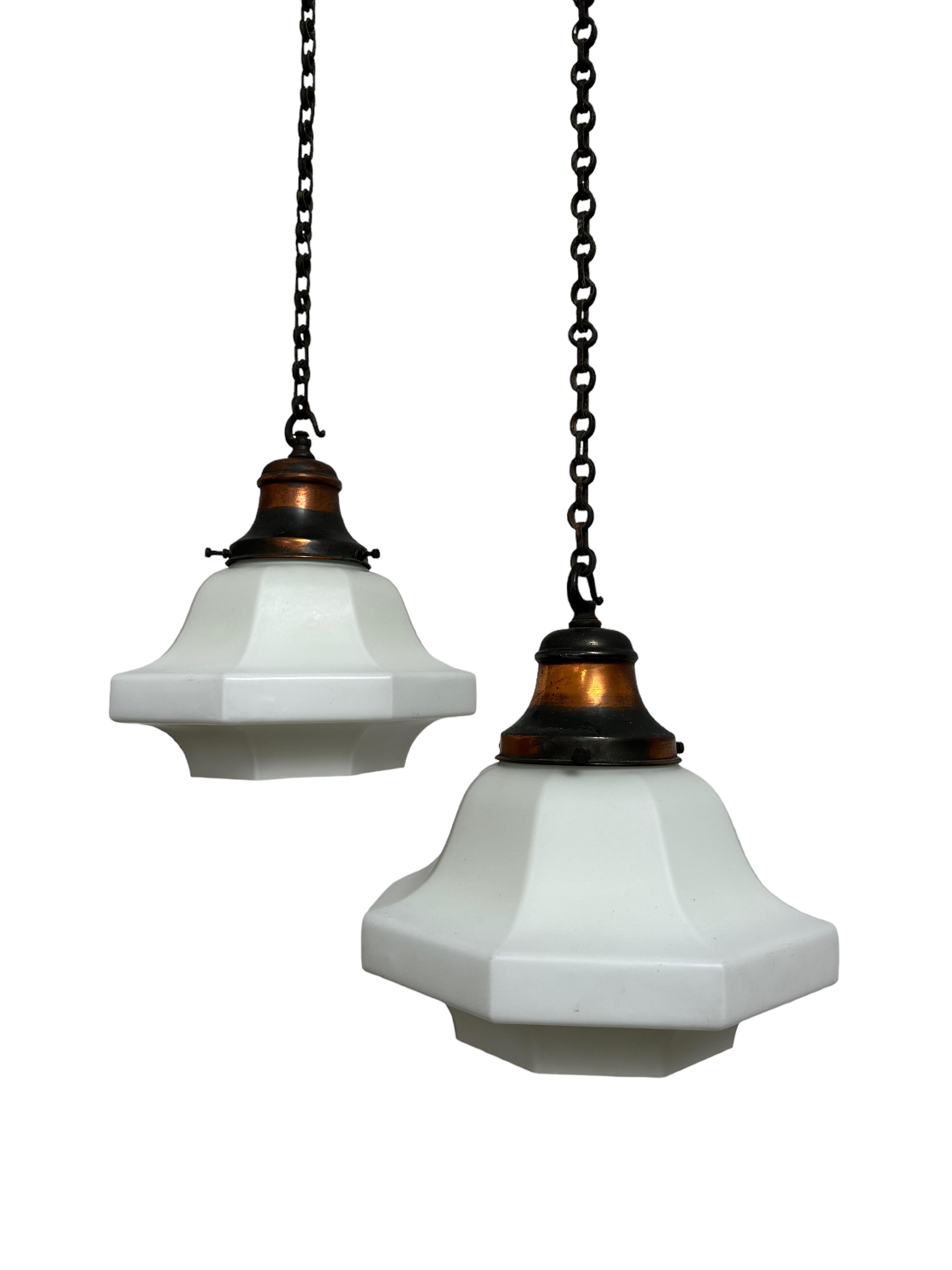 - A wonderful pair of Edwardian hexagonal opaline ceiling pendants, England circa 1910.
- Heavy quality satin opaline open glass shades with matching patinated copper galleries and original chain and hooked ceiling roses. 
- Wear commensurate with