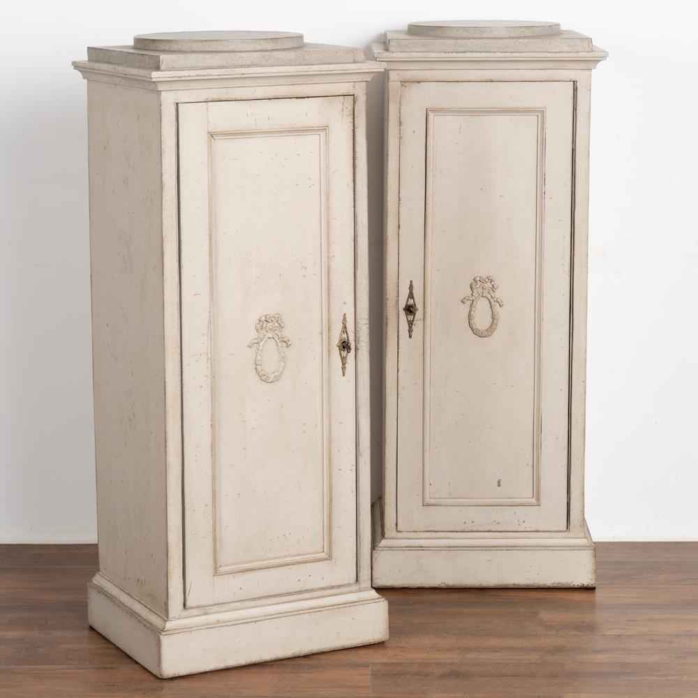 Pair, gray painted Gustavian narrow cabinets or 
