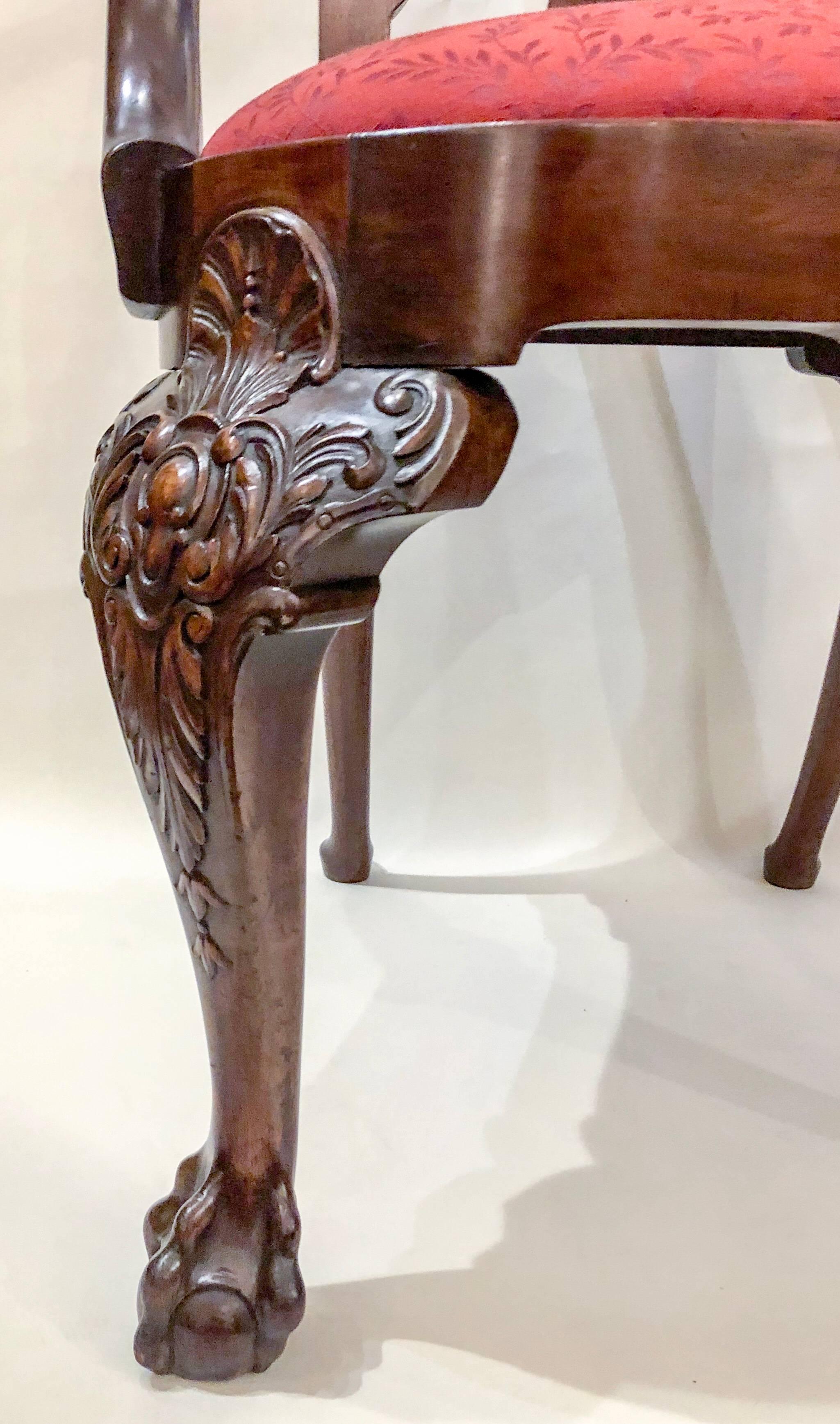 A nice pair of carved armchairs in the traditional style of English mid-19th century furnishings.
 