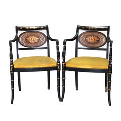 Coppia di antiche poltrone inglesi Hitchcock in stile Reggenza, ebanizzate, in canna e dorate