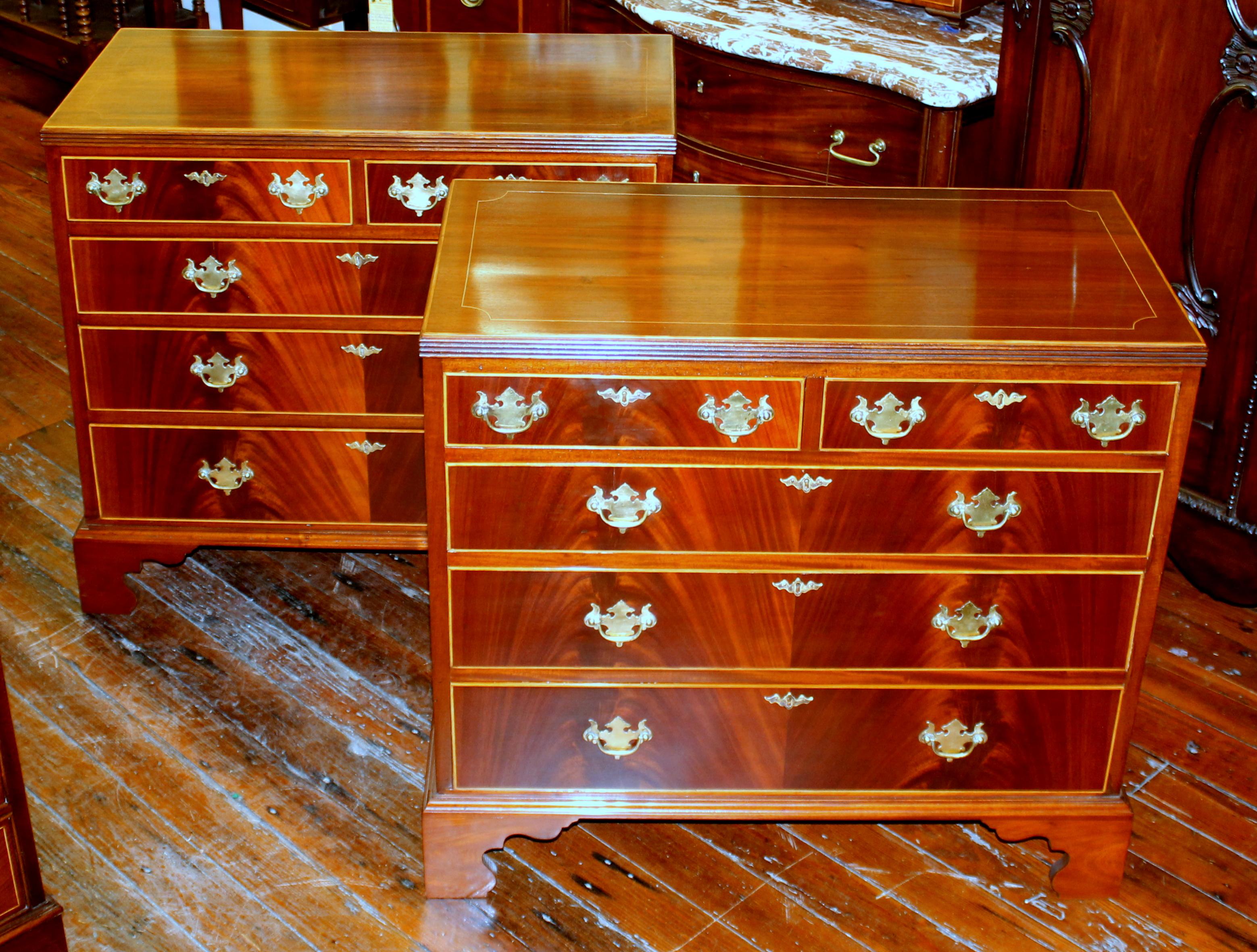 Very rare and fine pair of antique English inlaid and book-matched flame or crotch mahogany caddy top low chests of drawers; note the gorgeous 