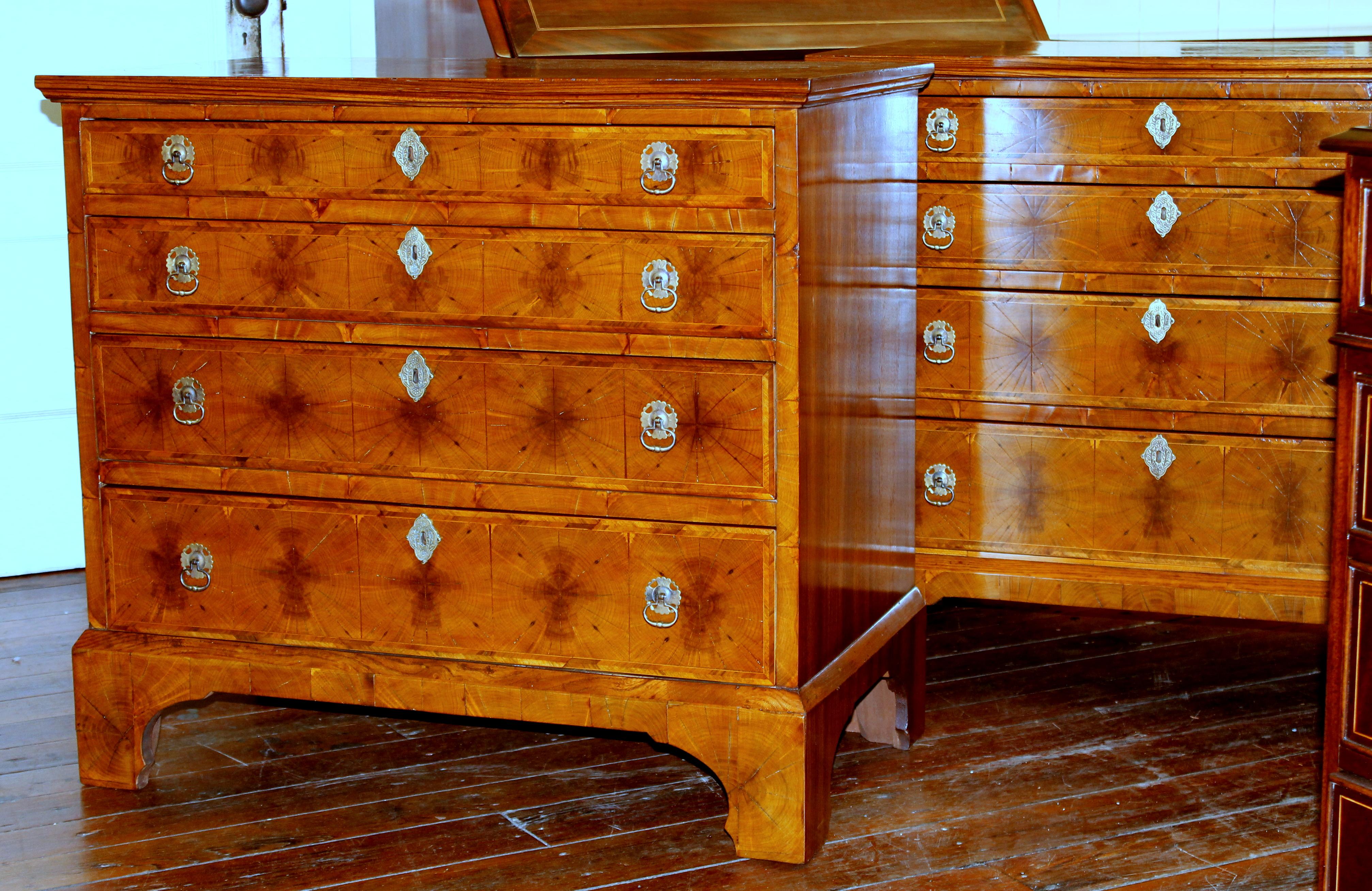 Very rare and fine pair antique English inlaid laburnum oyster veneer Queen Anne revival bachelor's chests.

Oyster veneers is a very delicate and intricate process of laying 