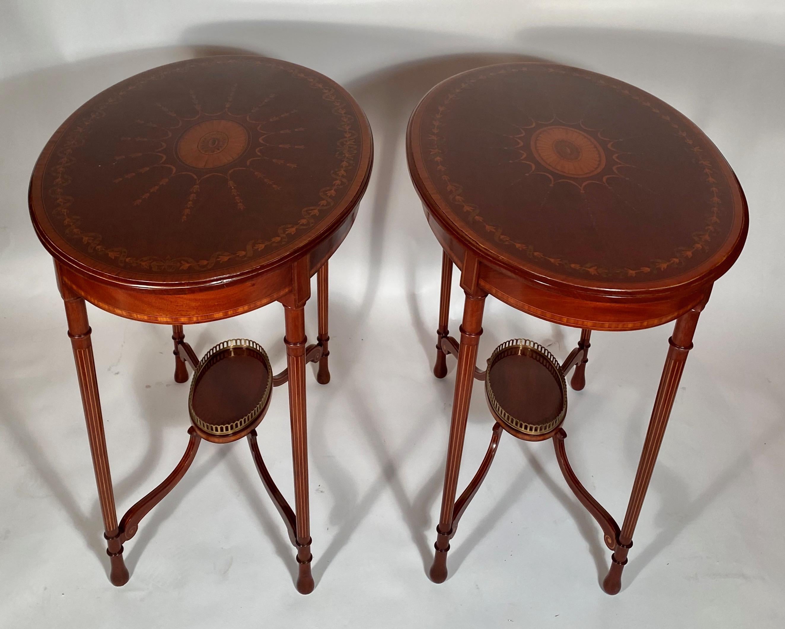 Such a pretty pair of occasional tables, with delicate inlay and a small galleried nesting area underneath. These are very versatile and pleasing.
 