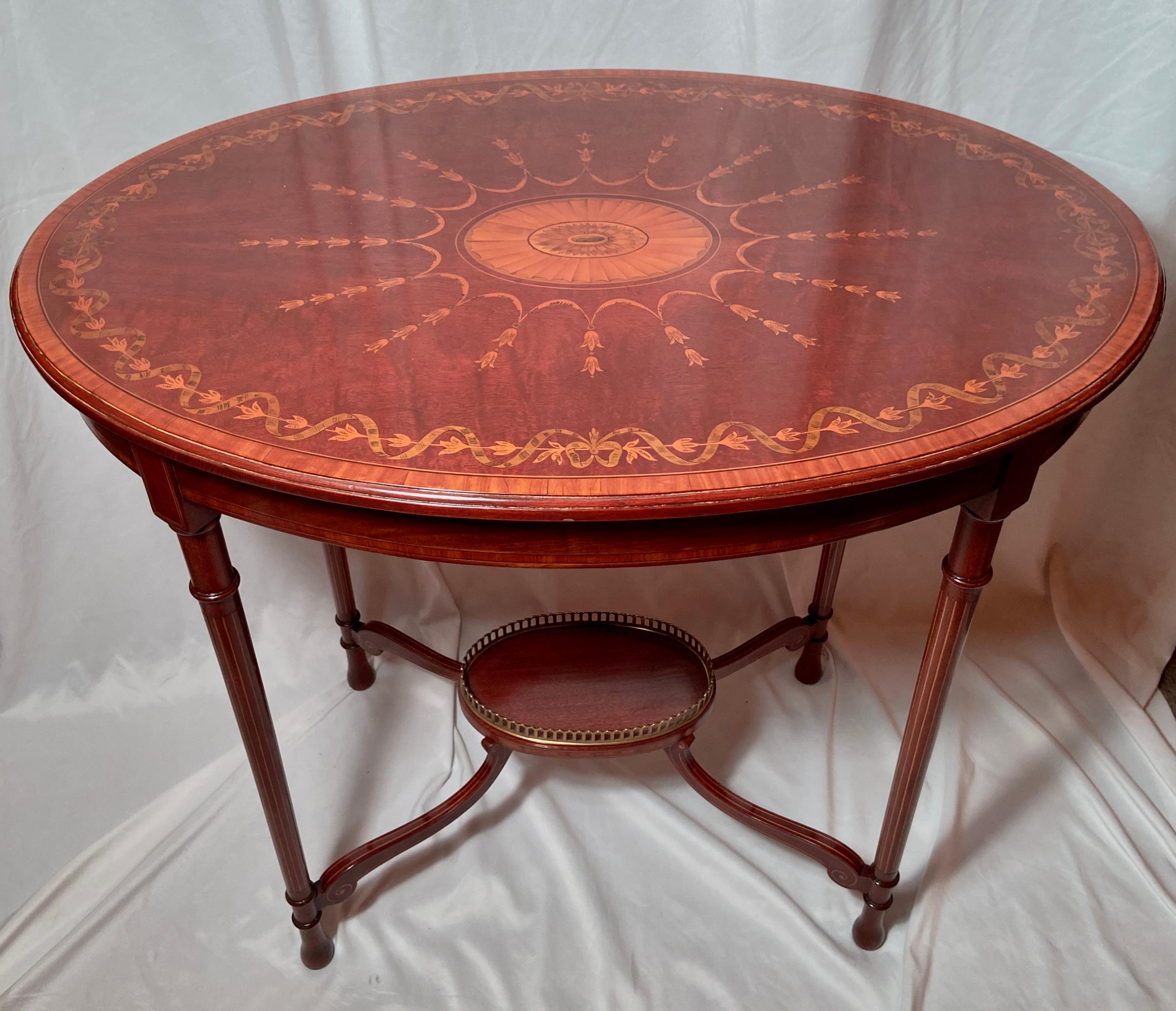 Antique English mahogany with exquisite inlay oval occasional table, Circa 1880.