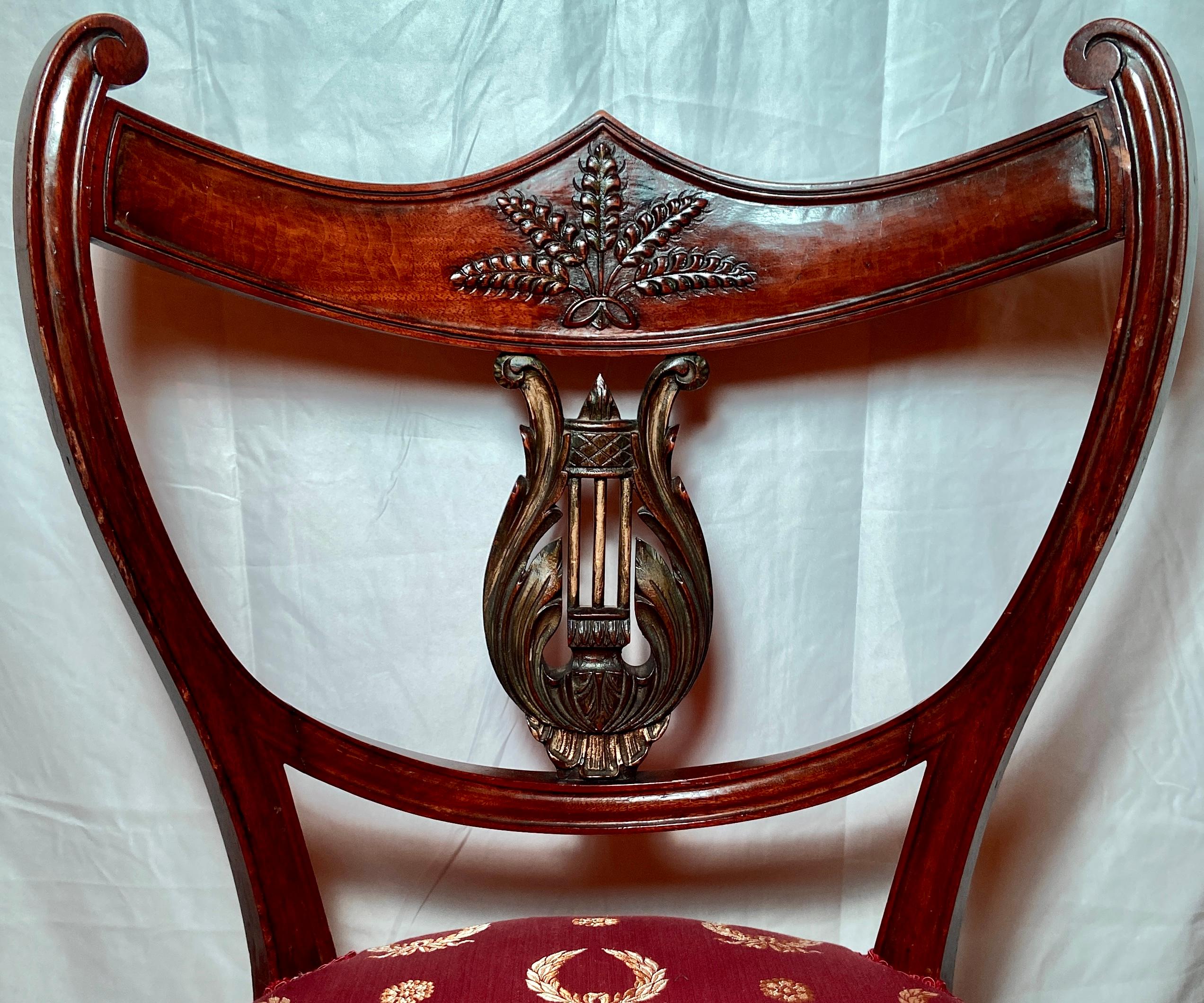 Pair antique English Regency Mahogany chairs, Circa 1820-1830. Beautiful lines and detail with new red and gold silk upholstery.