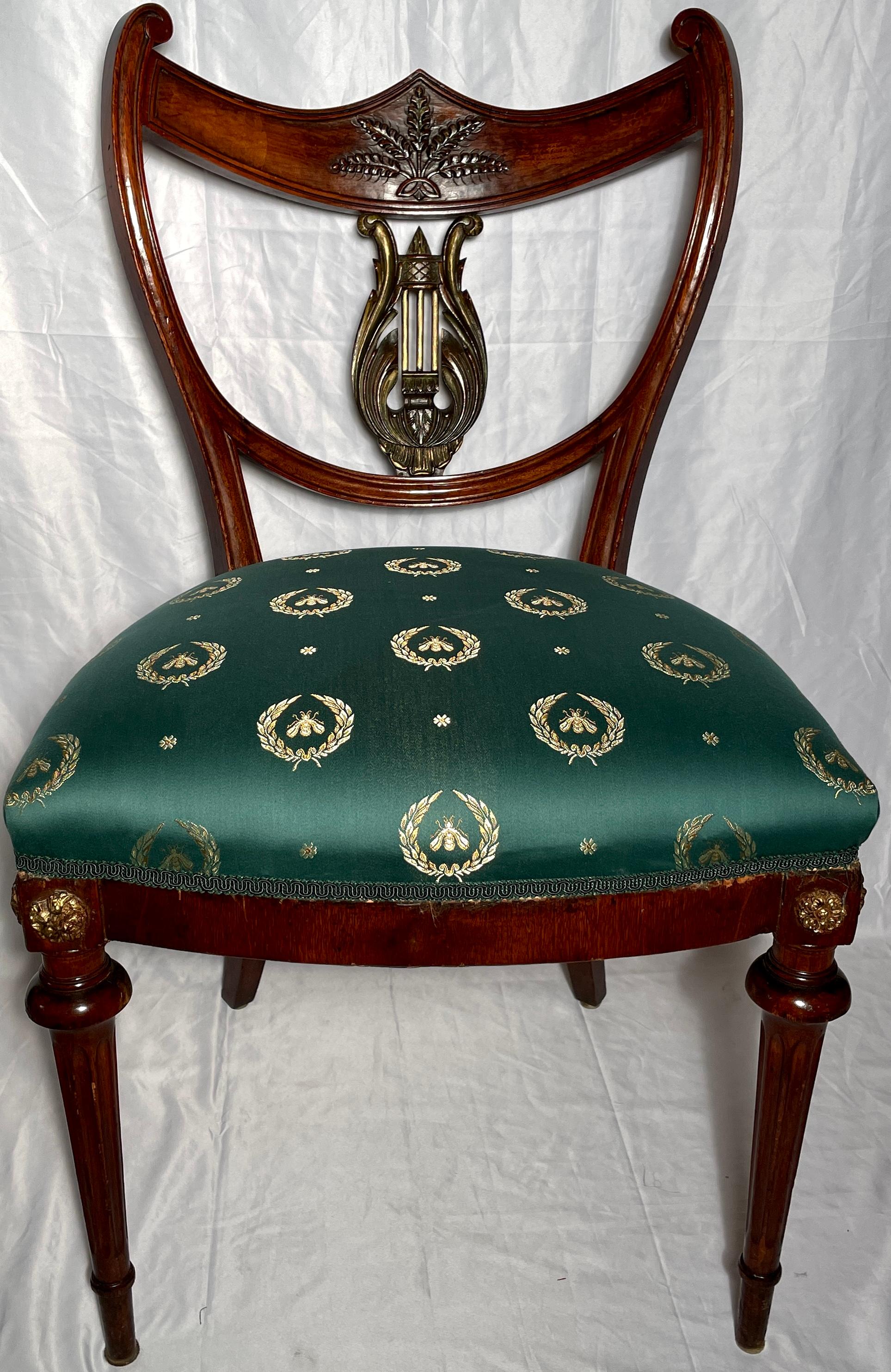 Pair antique English Regency mahogany chairs, circa 1820-1830. 
Upholstered in emerald green and gold silk fabric.