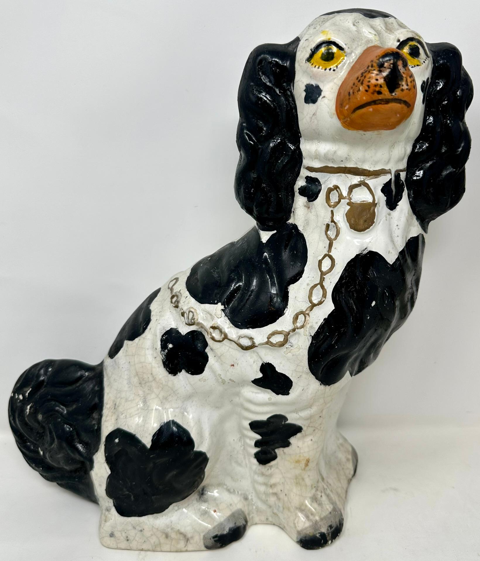 Pair Antique English Staffordshire Pottery Dogs Hand-Painted in Black & White, Circa 1860.
1 dog is 13