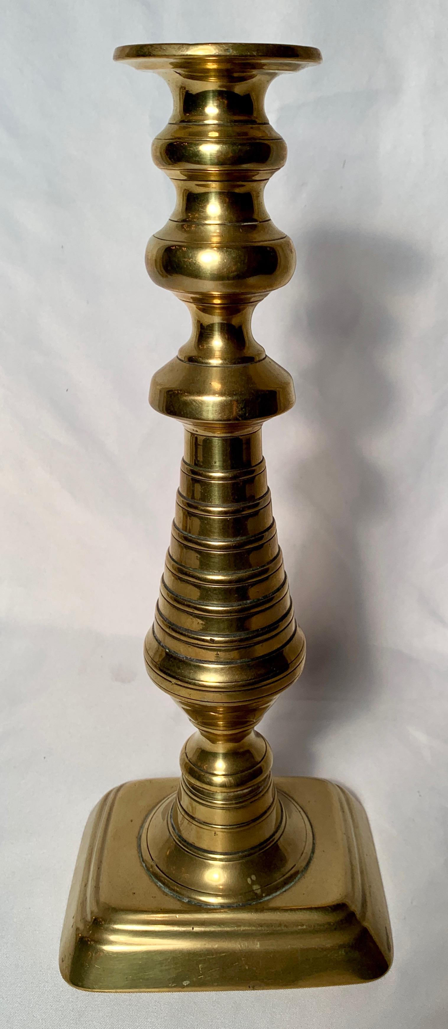 Pair of antique English Victorian brass candlesticks, circa 1880.
  
   