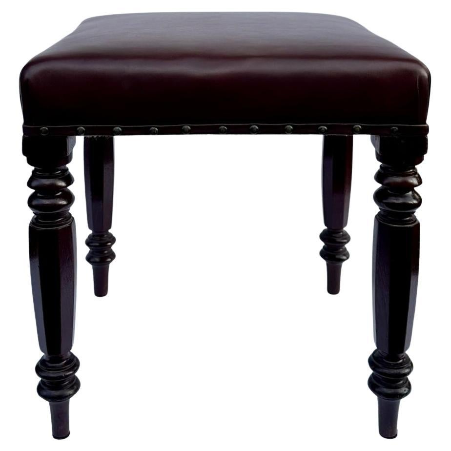 Stylish Hand Carved Victorian solid Mahogany frame upholstered identical pair of occasional Stools of square form and of English origin. Circa last quarter of the Nineteenth Century. 
Each solid frame constructed in figured mahogany, the rectangular
