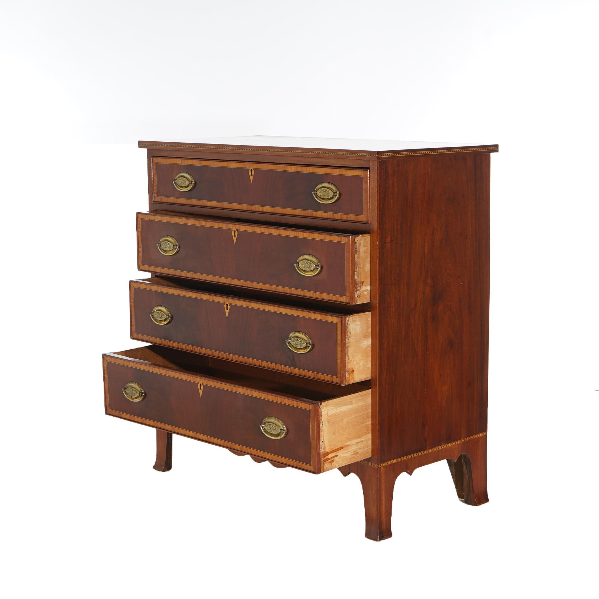 ***Ask About Discounted In-House Shipping***
A pair of antique Federal dressers offer flame mahogany construction, each having four drawers with satinwood crossbanding and eagle embossed brass pulls, over shaped skirt and raised on splayed legs,