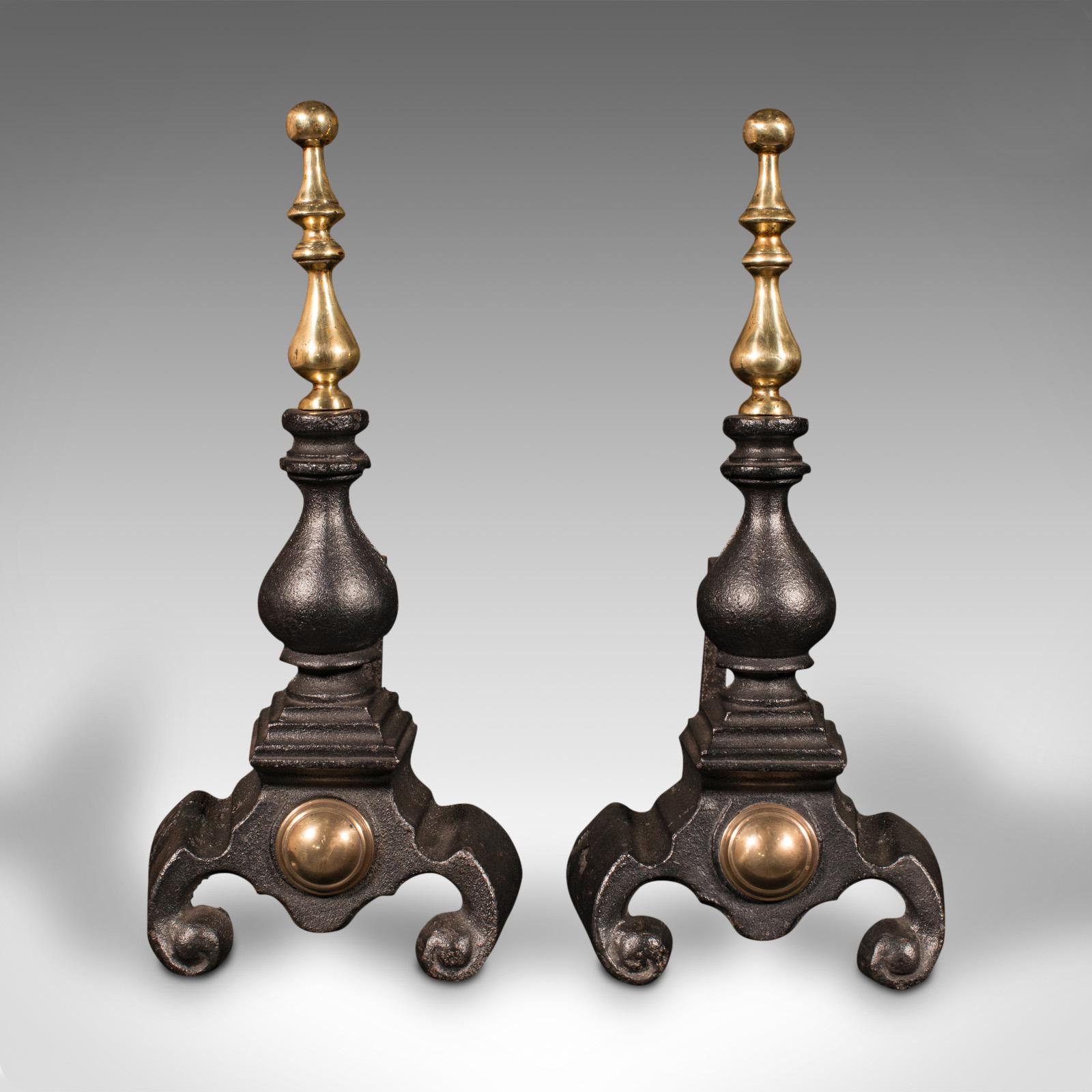 This is a pair of antique fireside tool rests. An English, cast iron and brass decorative andiron or fire dog, dating to the late Victorian period, circa 1900.

Substantial and attractive rests ideal for the fireside
Displaying a desirable aged