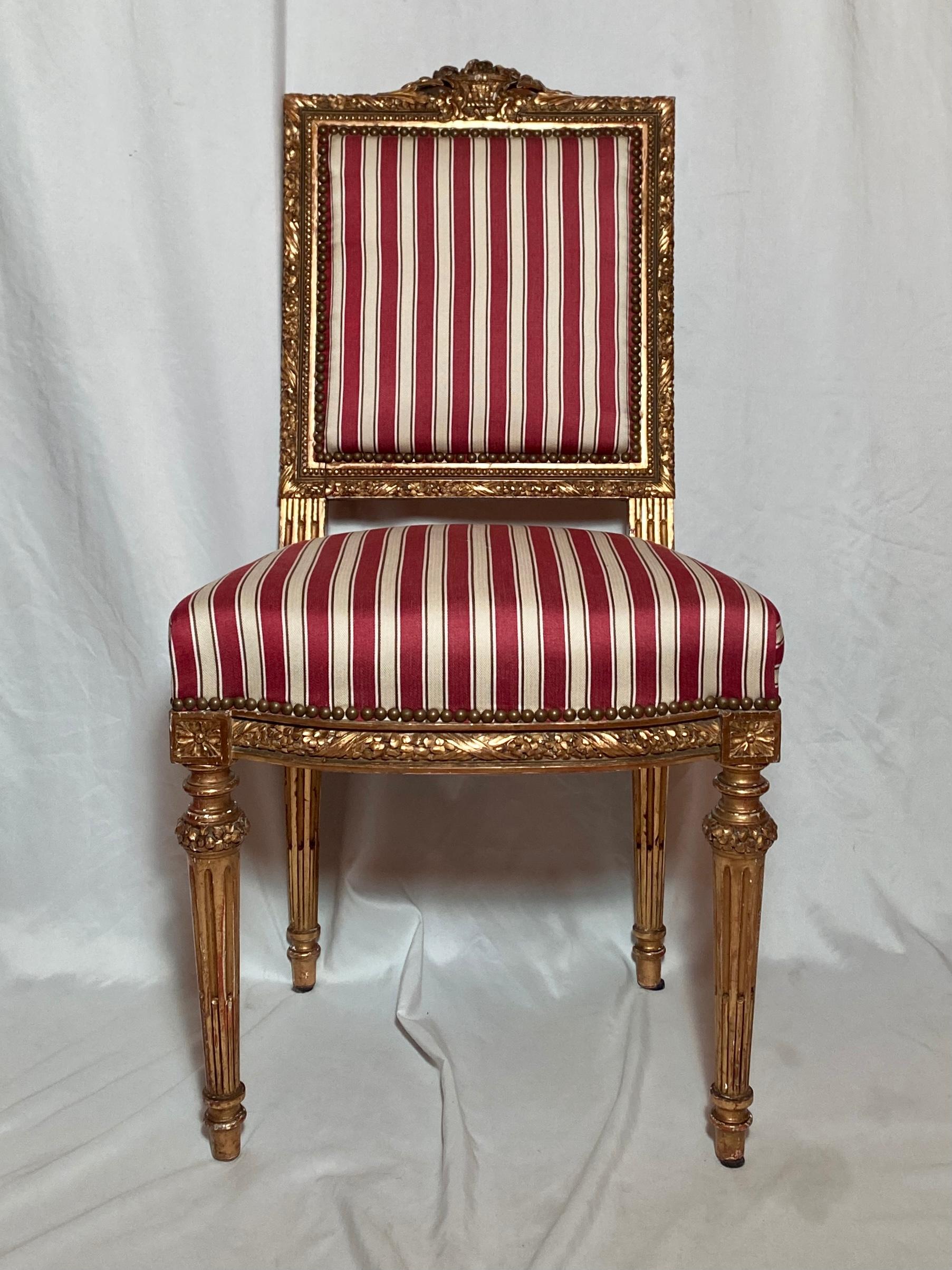 Pair antique French 18th century Louis XVI side chairs, carved wood with gold.
 