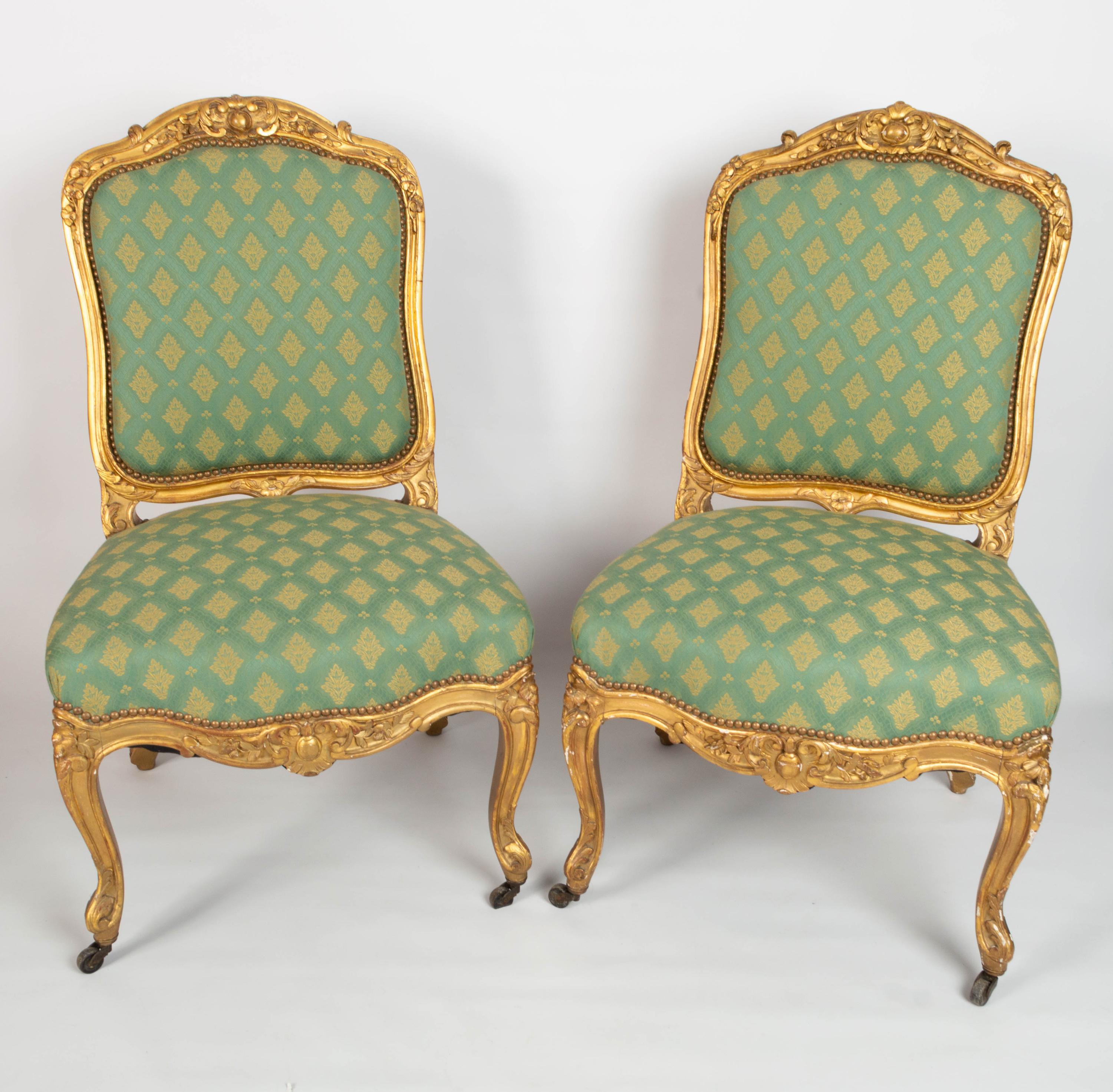 Pair Antique French 19th century Louis XV Style Giltwood salon chairs

A superb pair of Louis XV-style gilt wood salon chairs.
c.1870, France.
Each chair traditionally upholstered in a woven green fabric.

Solid and sturdy chairs, presented in