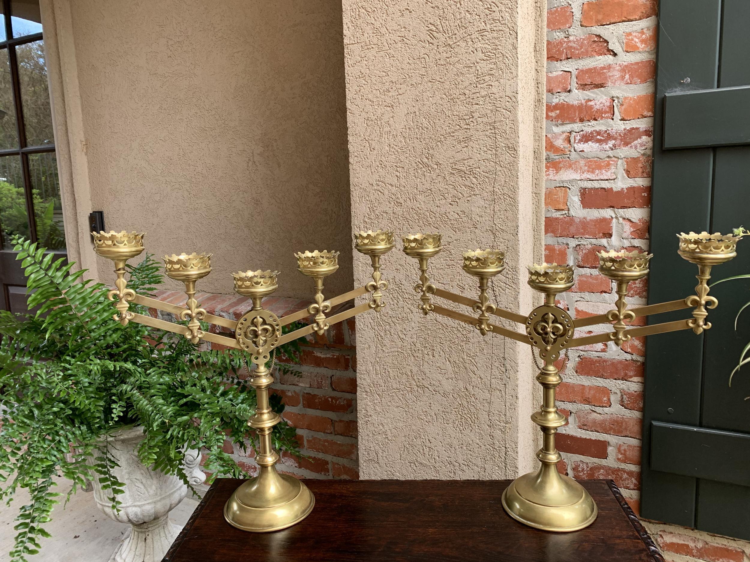 Pair antique French brass Altar candelabra adjustable fleur de lis candlestick

~Direct from France~
~Lovely pair of antique French altar candlesticks, one of several unique liturgical items in our most recent French container~
~Each candelabra has